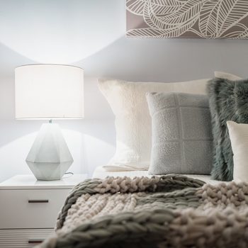 Bedroom with a lit lamp