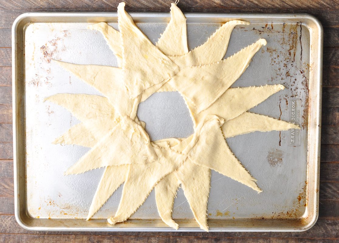 Crescent dough spread out in a circle on a pan