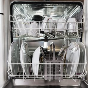 Photo Of Utensils Arranged In Dishwasher In Kitchen
