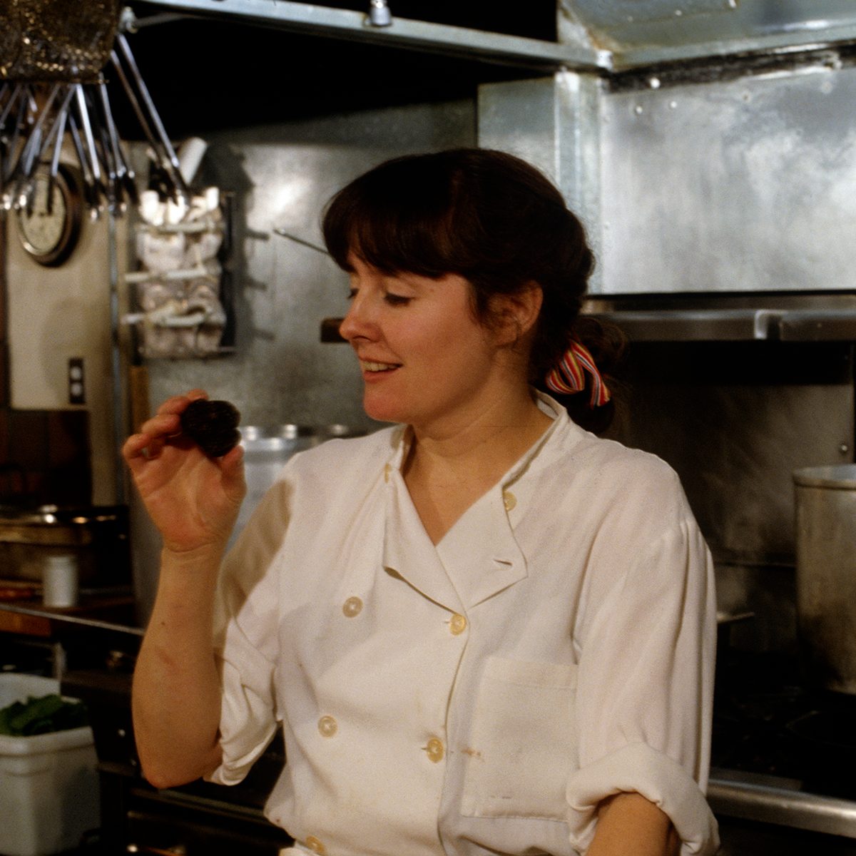 American chef and restaurateur Alice Waters at work in the kitchen of her restaurant