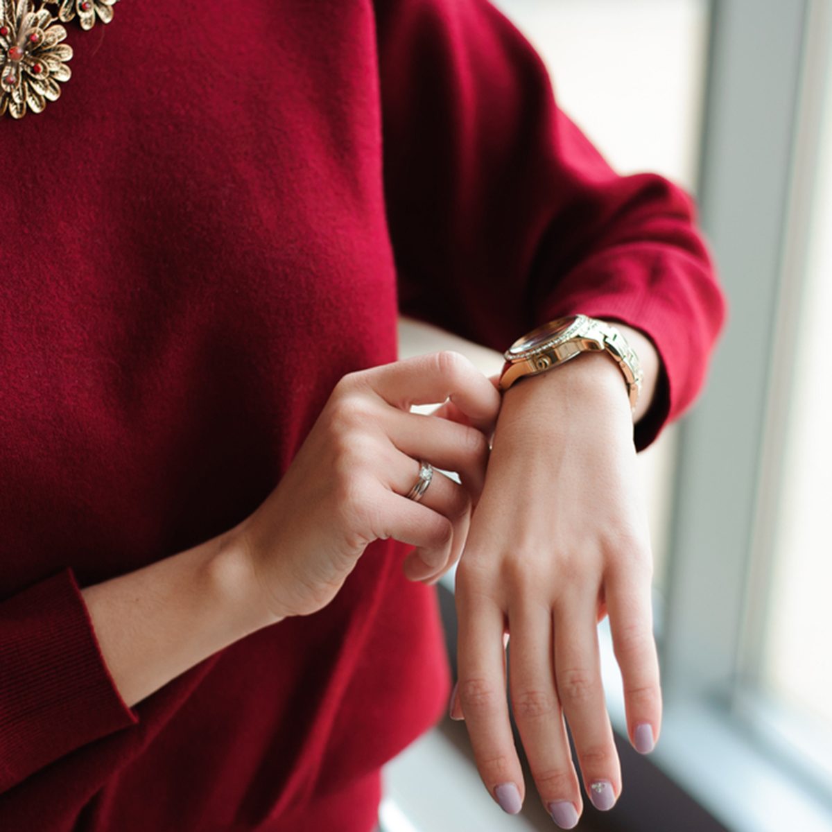 beautiful woman looks at the clock waiting for the plane at the airport; Shutterstock ID 551316502