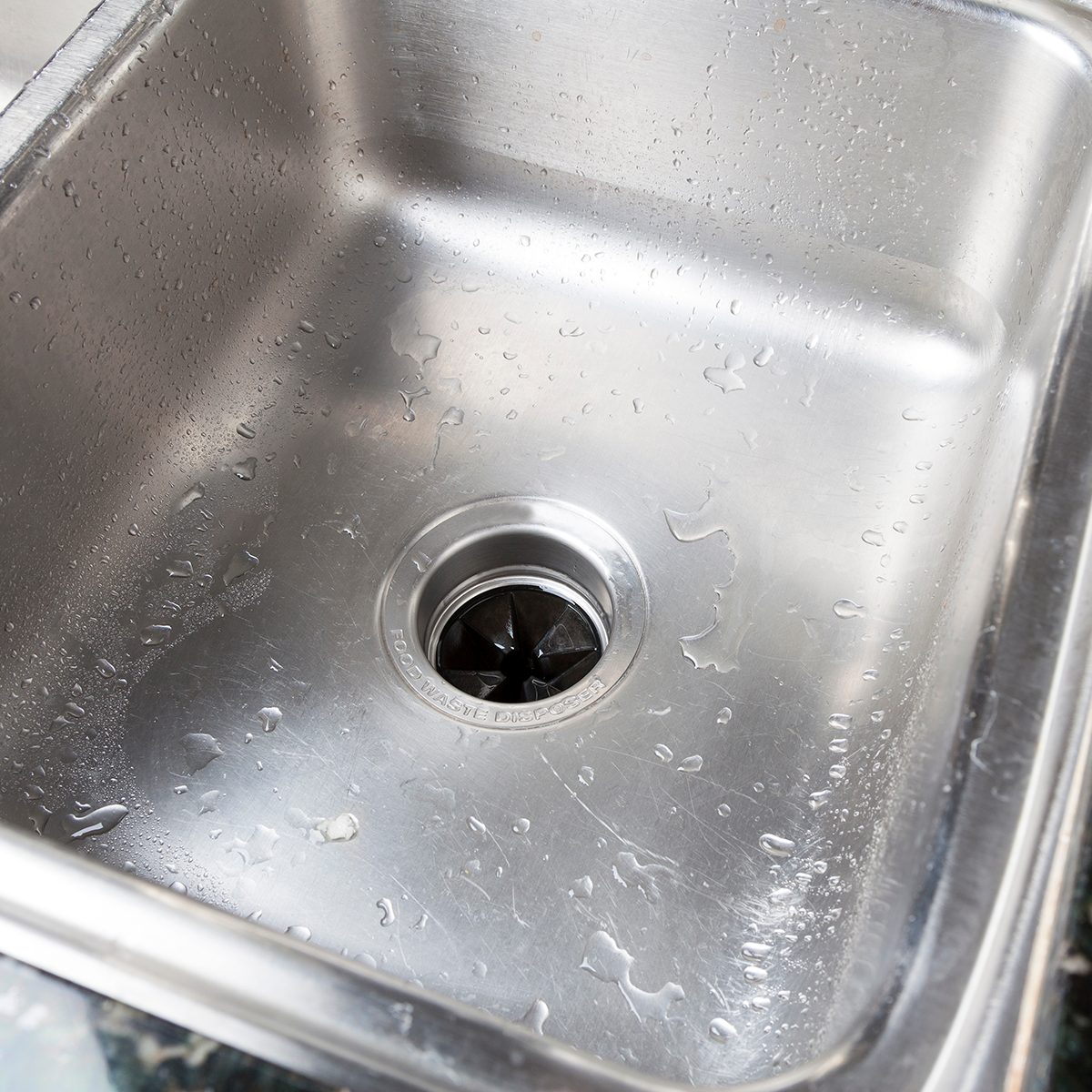 Stainless steal kitchen sink with water drops