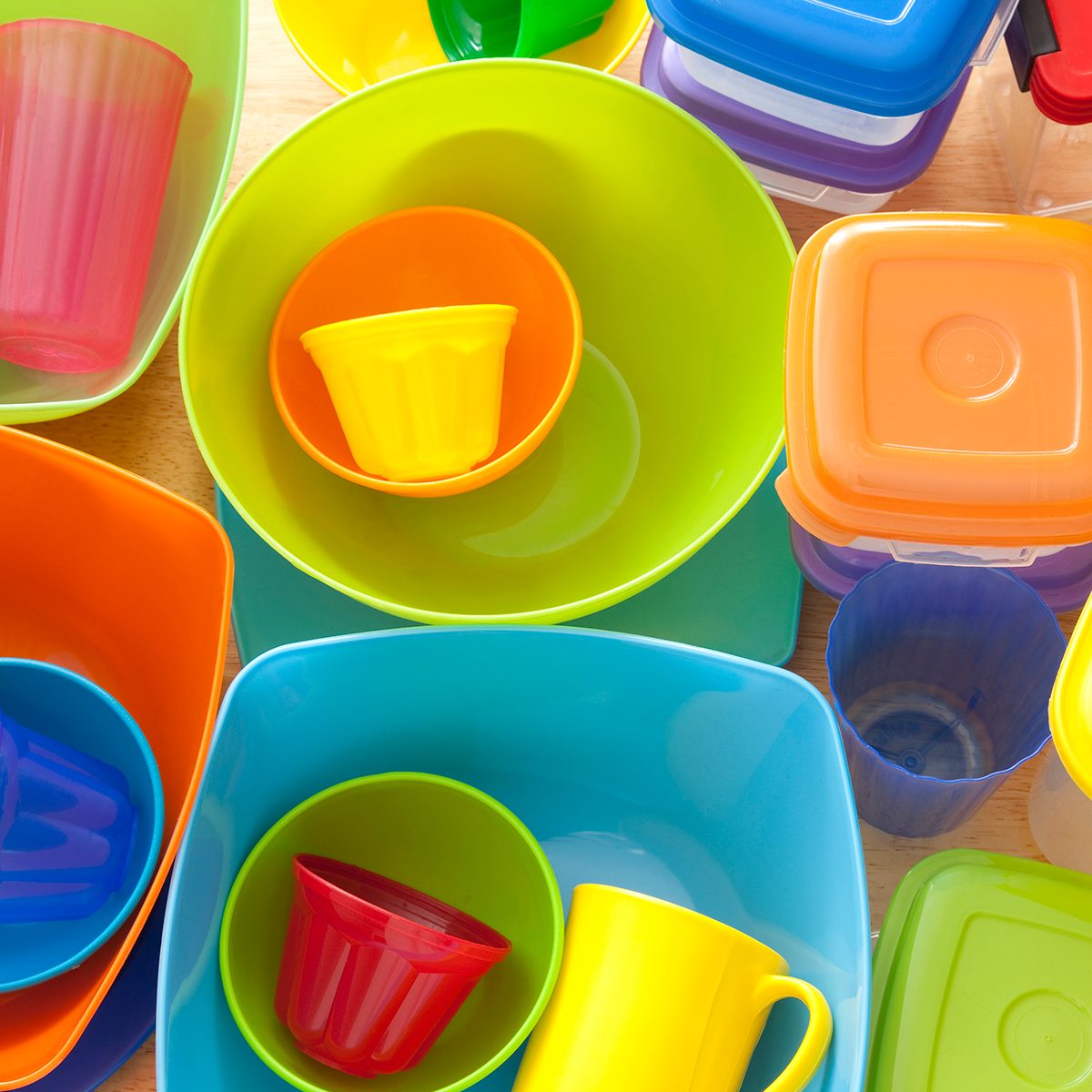 Top view of lots of plastic kitchen utensils, mostly containers