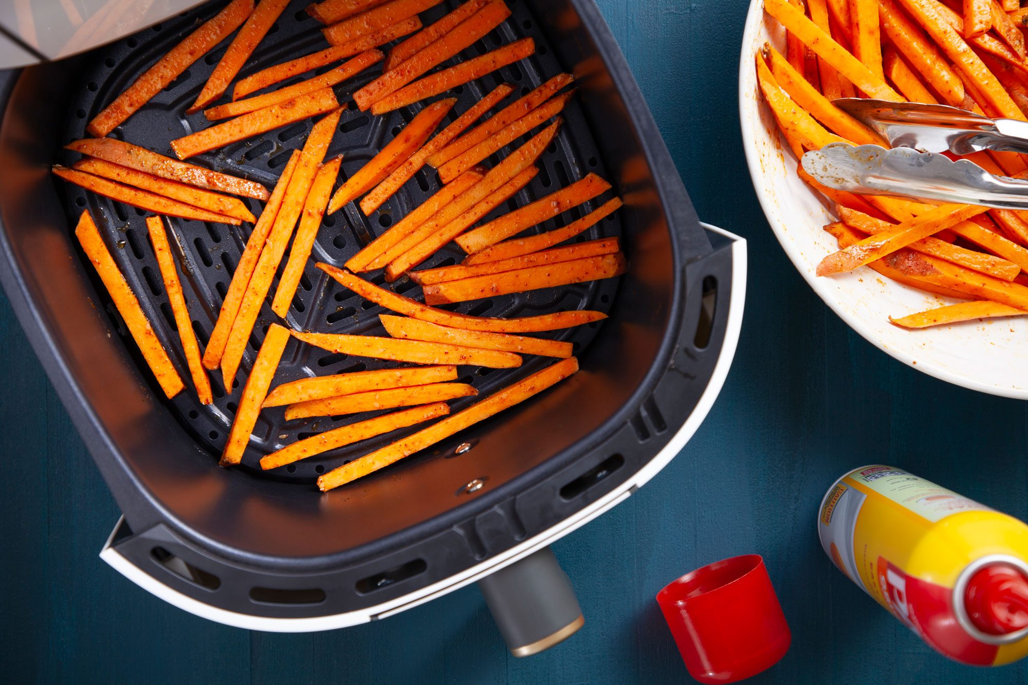 Air Fryer Sweet Potato Fries in greased air-fryer