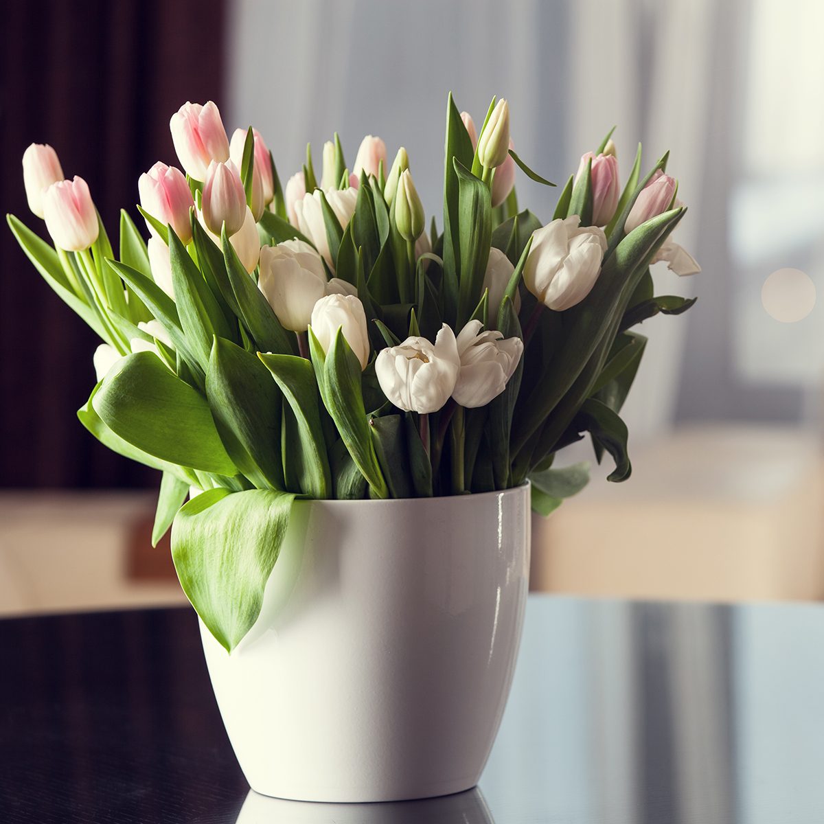 Fresh pink tulip flowers bouquet on the table.