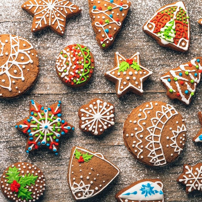 Christmas gingerbread cookies on wooden table with sugar