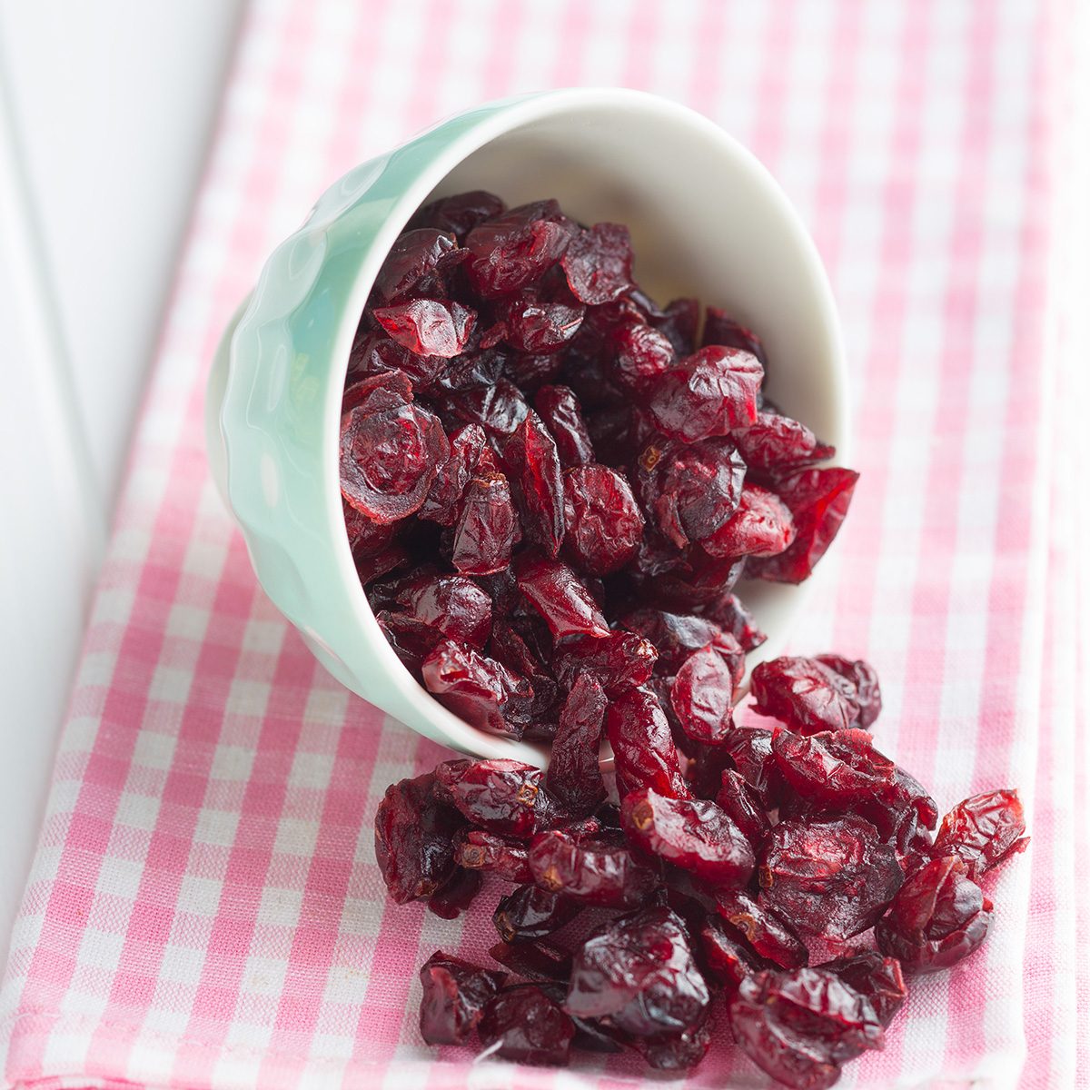 Tasty dried cranberries in bowl; craisins