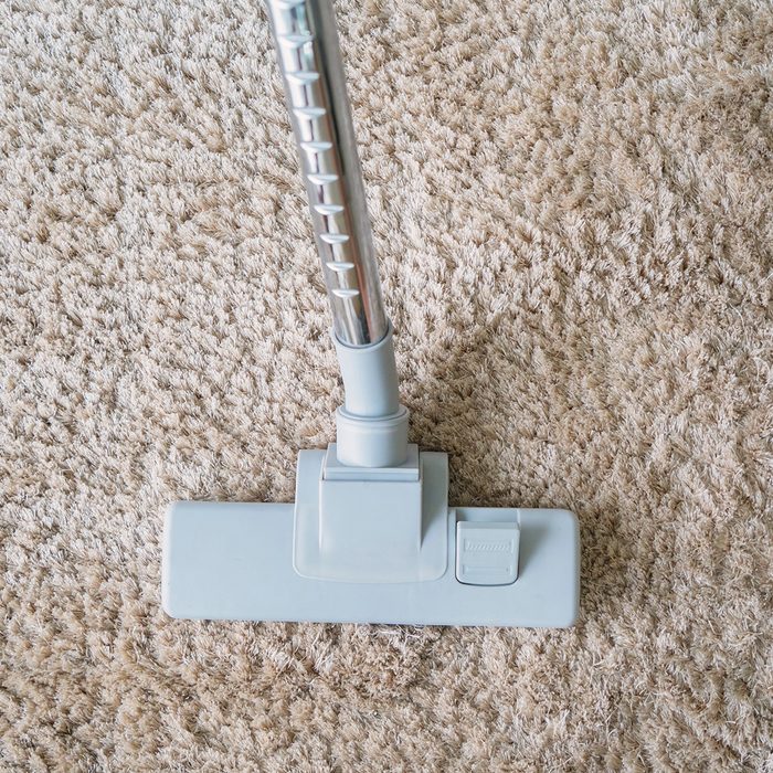 Vacuuming carpet