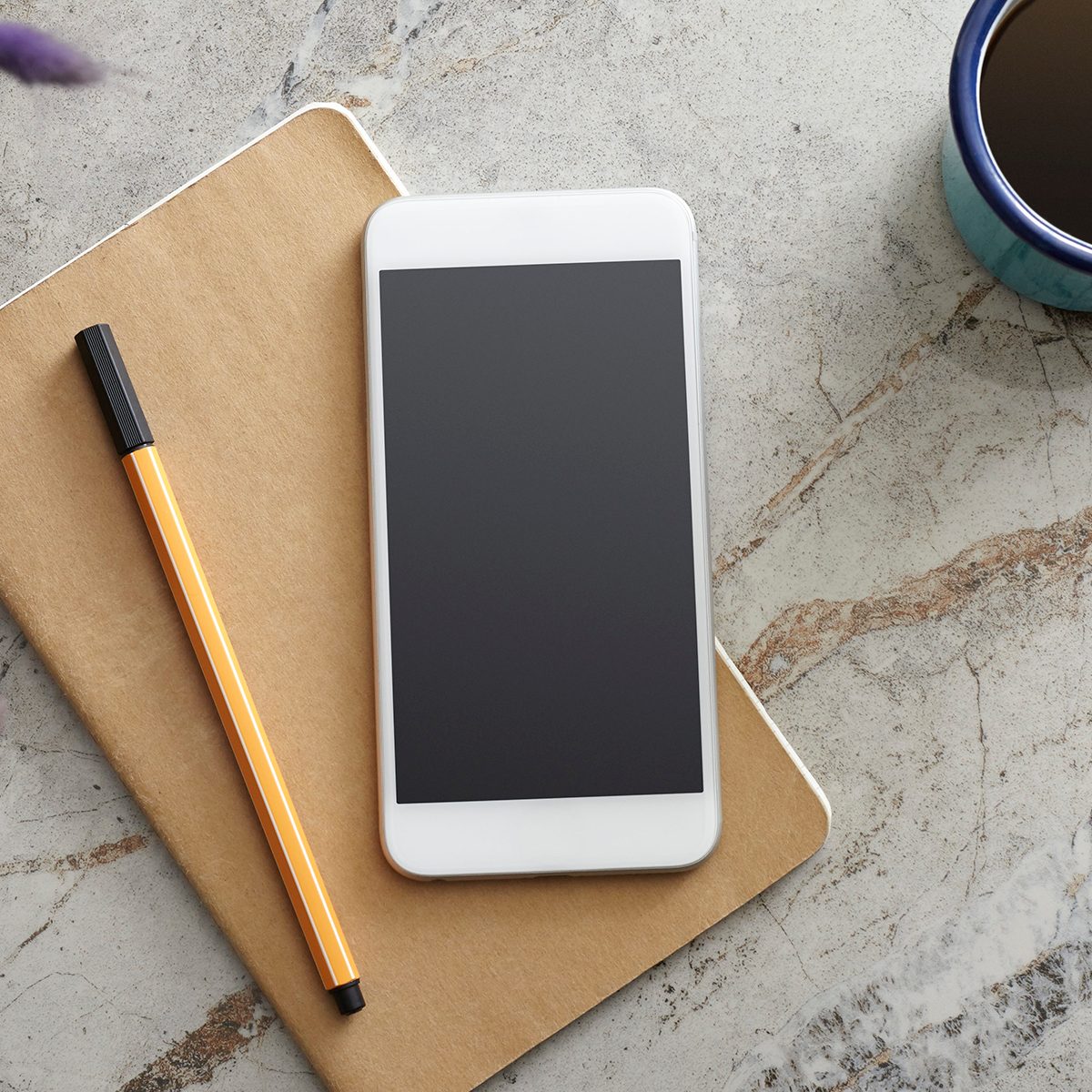 Smart Phone and Notebook on the Desk