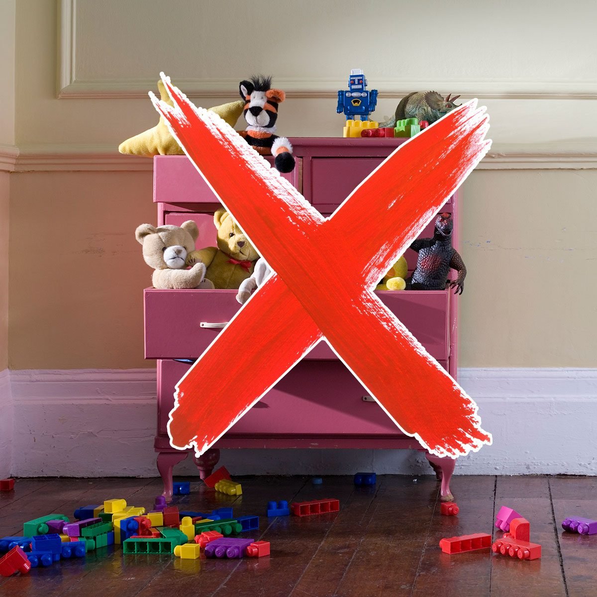 Dresser filled with toys and a red 