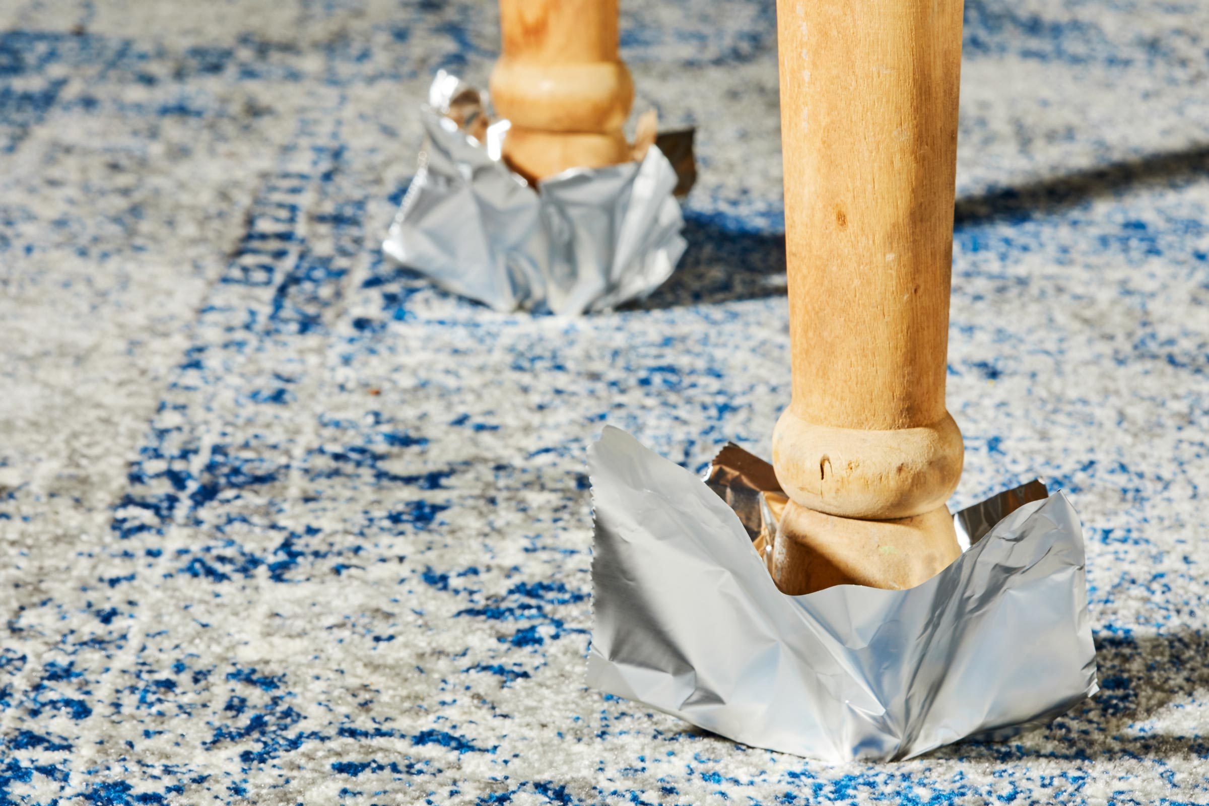 moving heavy furniture by putting foil on the legs