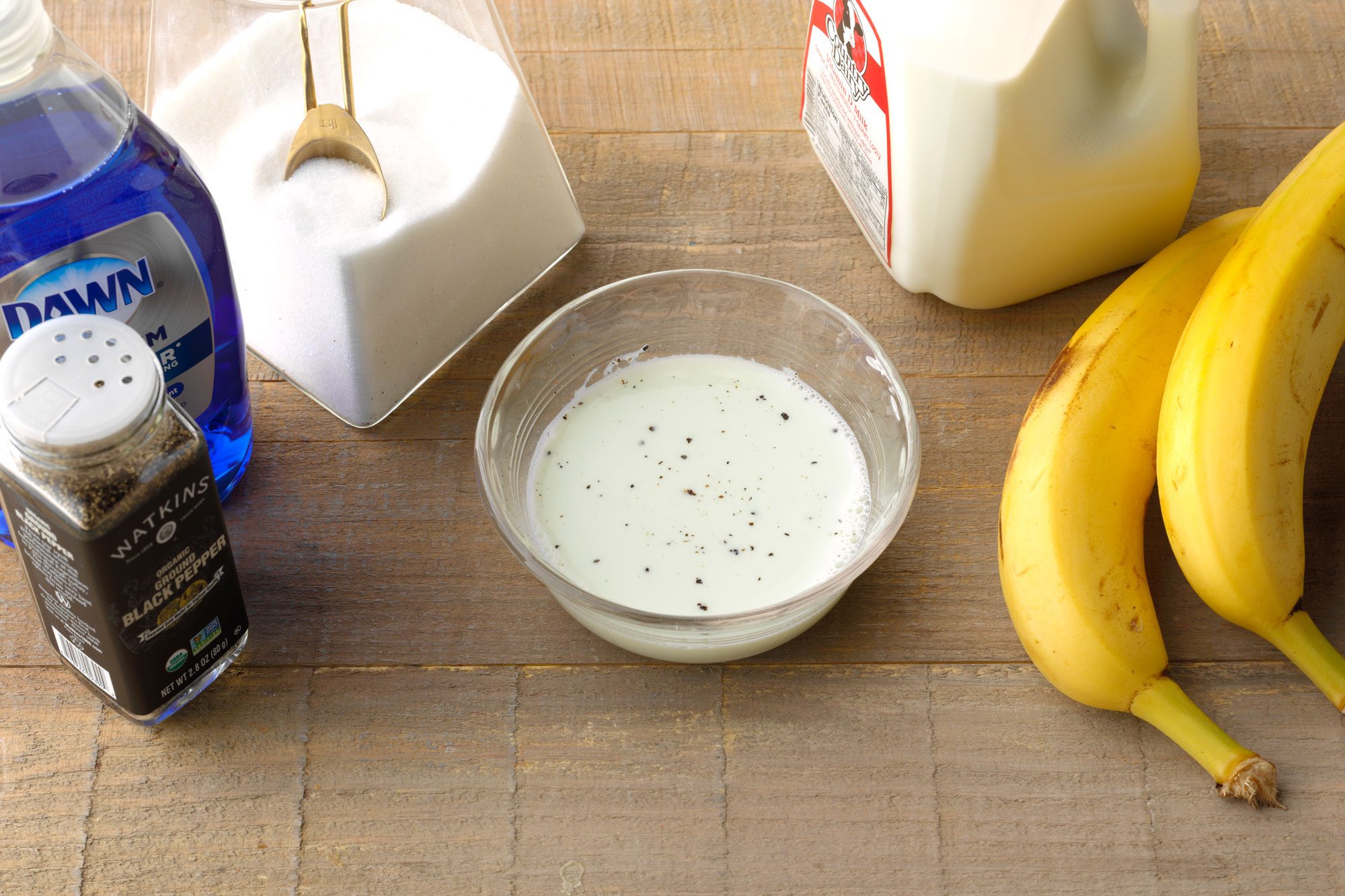 trap 2 mixture in a bowl with the supplies arranged nearby on a wooden surface