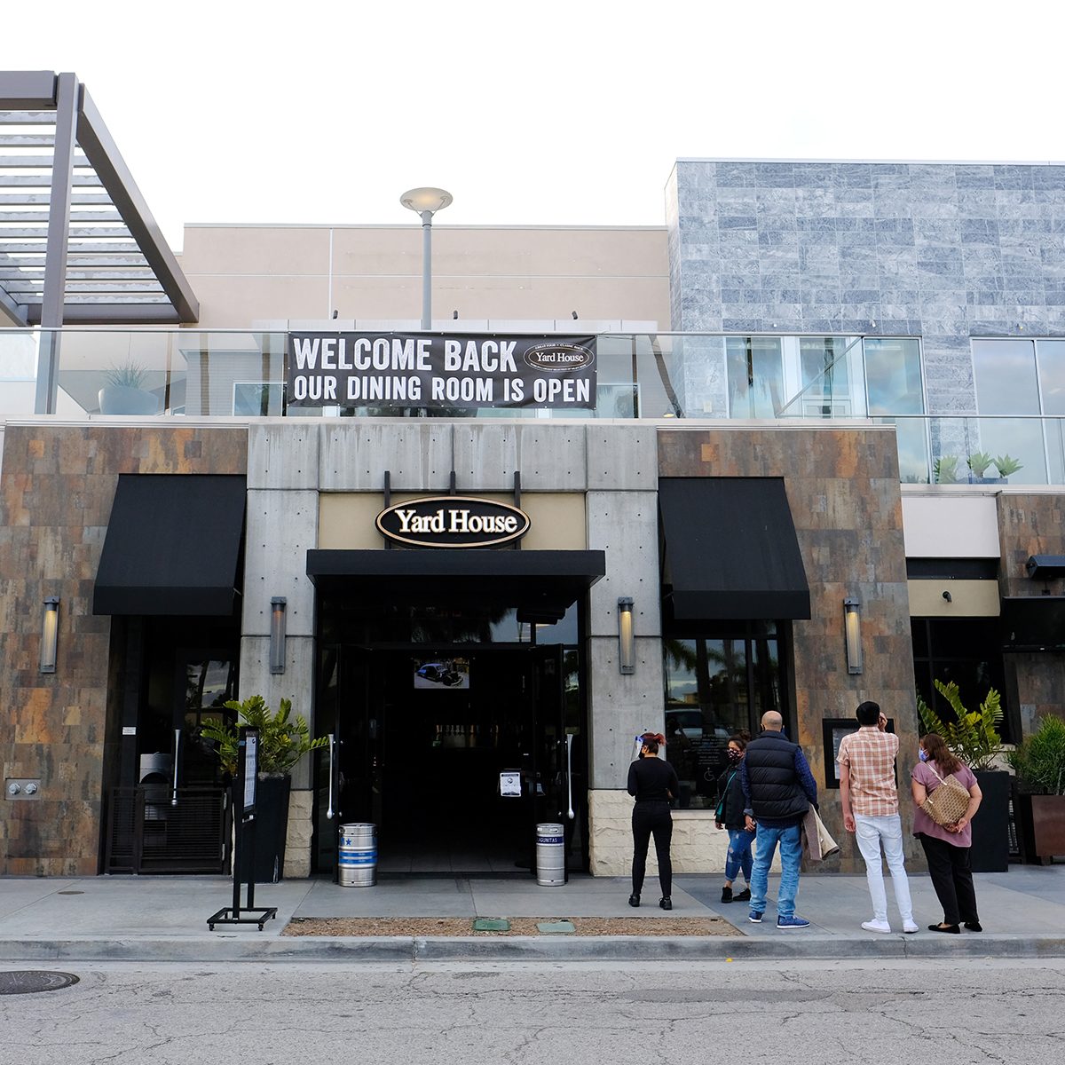 MARINA DEL REY, CALIFORNIA - JUNE 05: Customers are seen waiting to be seated at Yard House on June 05, 2020 in Marina del Rey, California. In an effort to contain the spread of COVID-19, restaurants in Los Angeles County have only been able to offer take-out service since late March. As part of Phase 3 of reopening California, many restaurants are now open with dine-in options available. (Photo by Amanda Edwards/Getty Images)