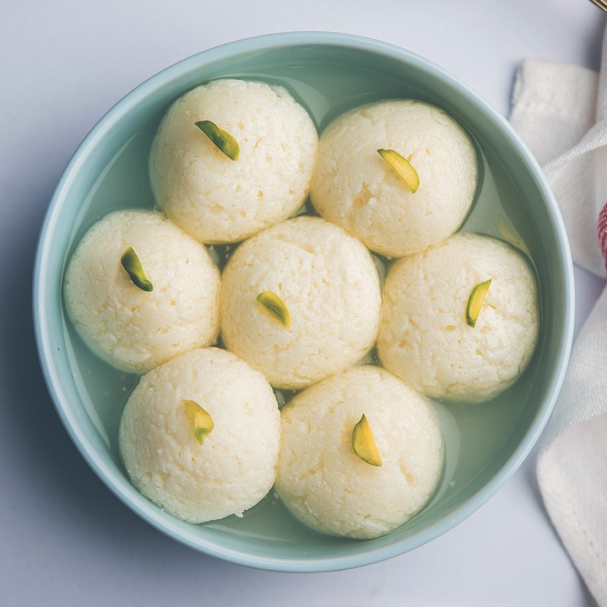 Indian Rasgulla or Rosogulla dessert/sweet served in a bowl. selective focus