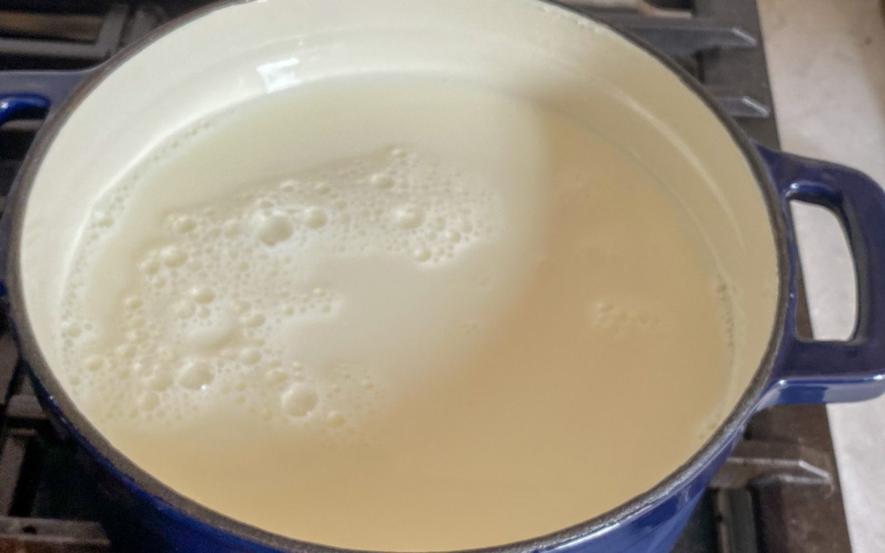 milk inside the dutch oven ready to be boiled
