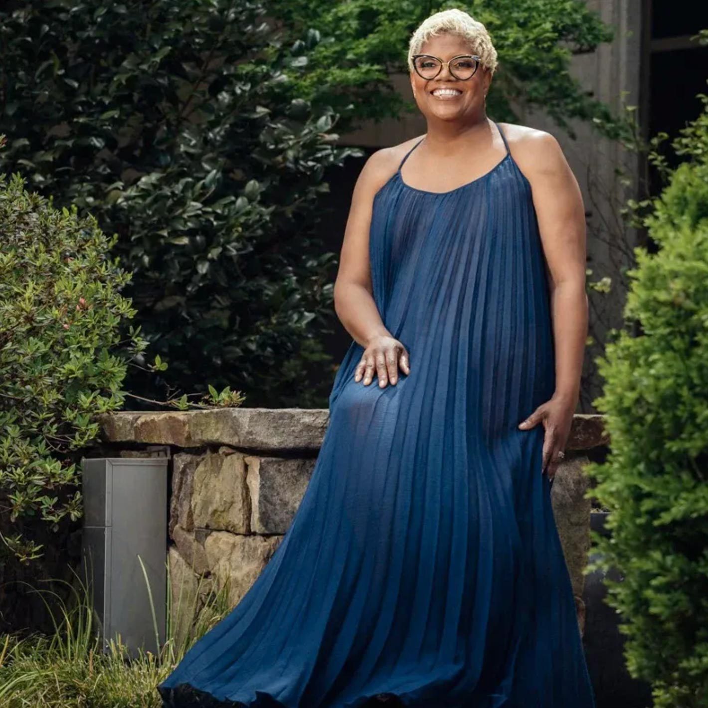 portrait of Deborah Vantrece outside in a long blue dress