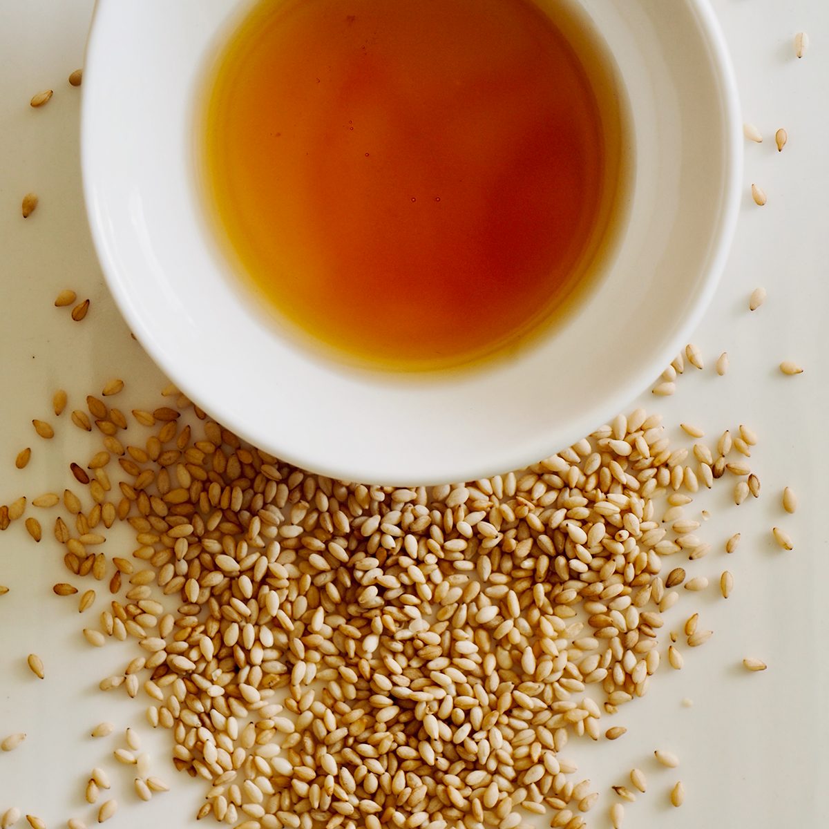 White Porcelain Plate, Sesame Oil And Sesame