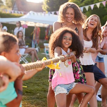 Game Of Tug Of War At Summer Garden Fete