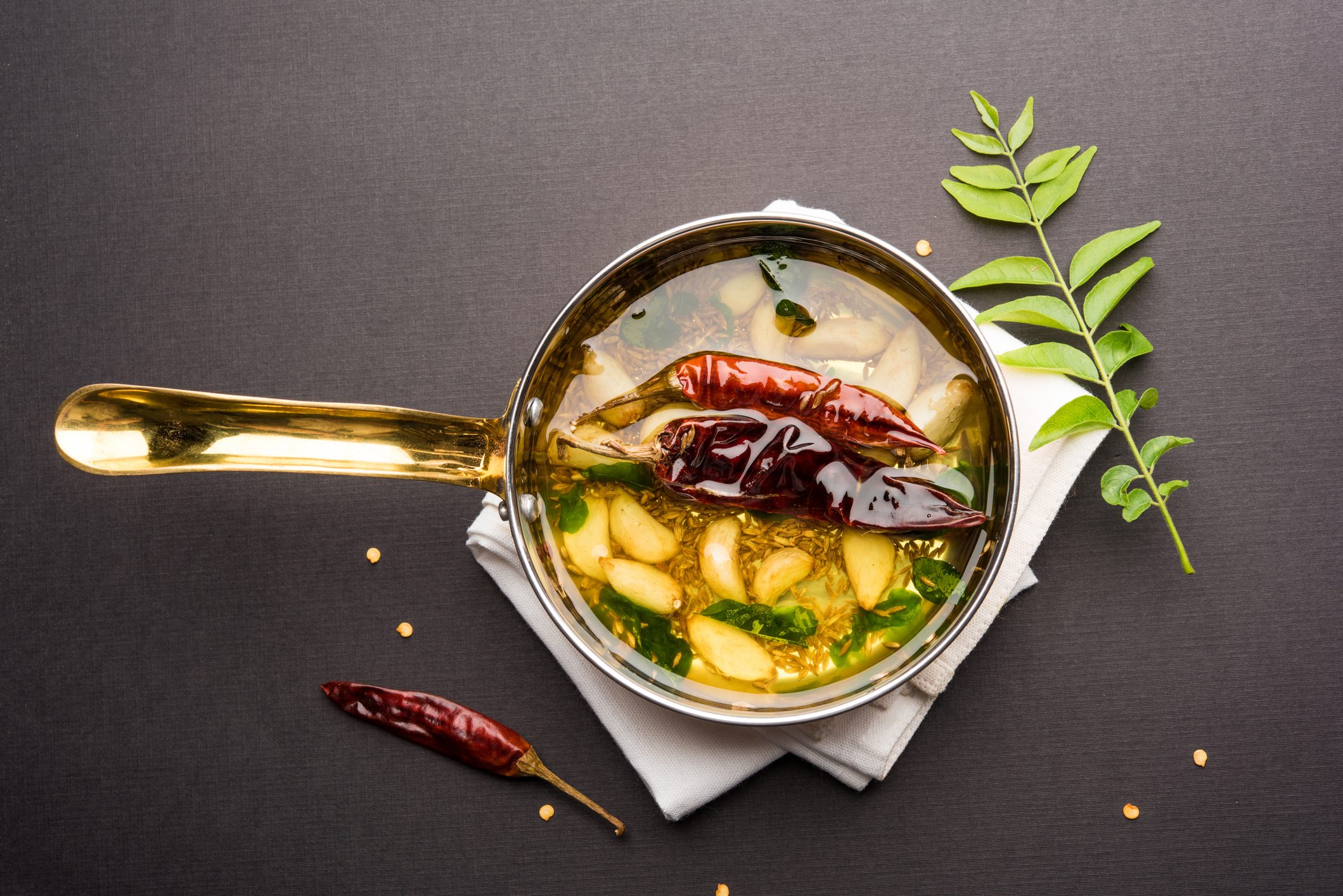 Tadka /Tempering spices also known as baghaara, fodni, tarka or vaghaar. Typically prepared in special pan with handle