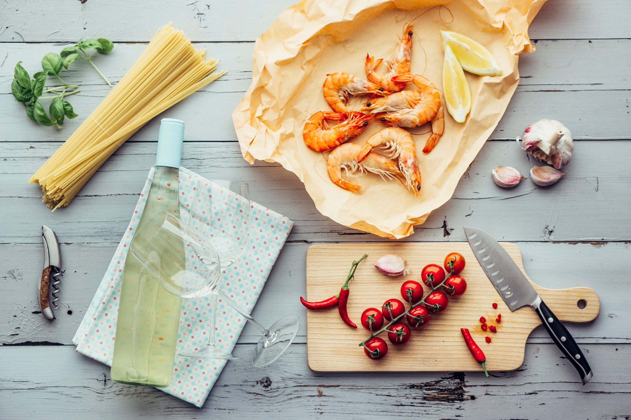 bottle of sauvignon blanc wine with prawns and pasta