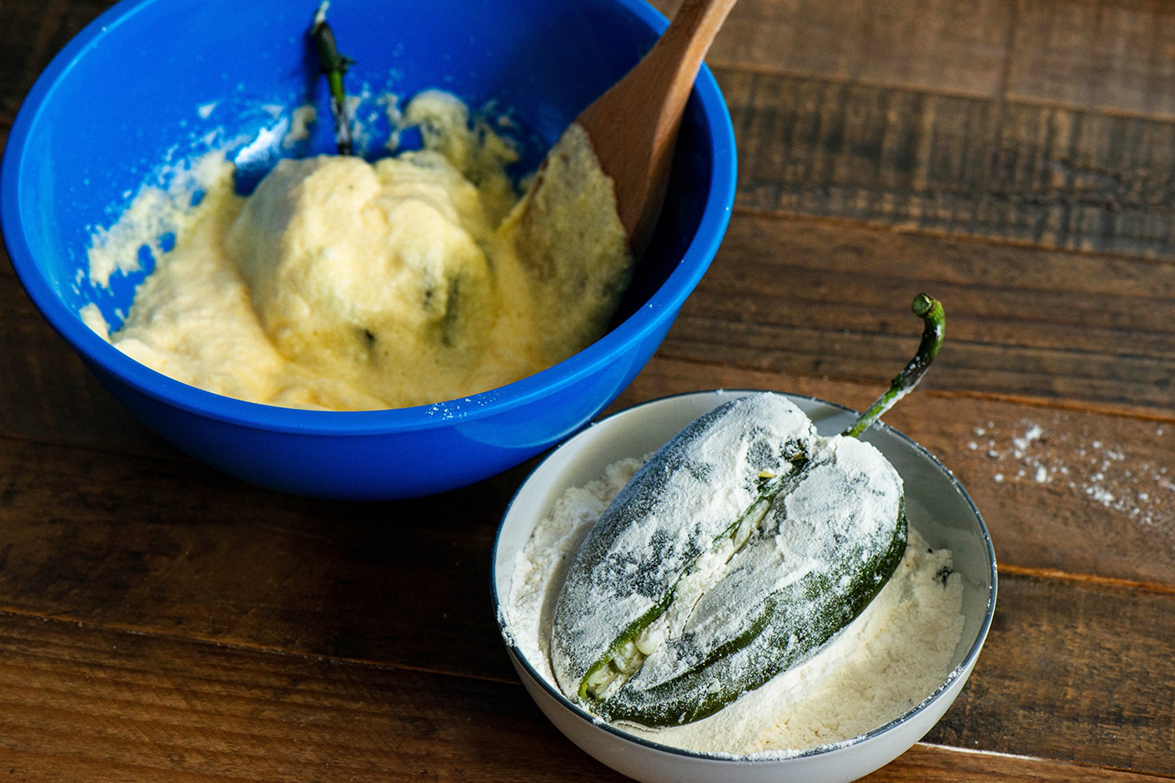 Dredging Chiles in flour and egg batter