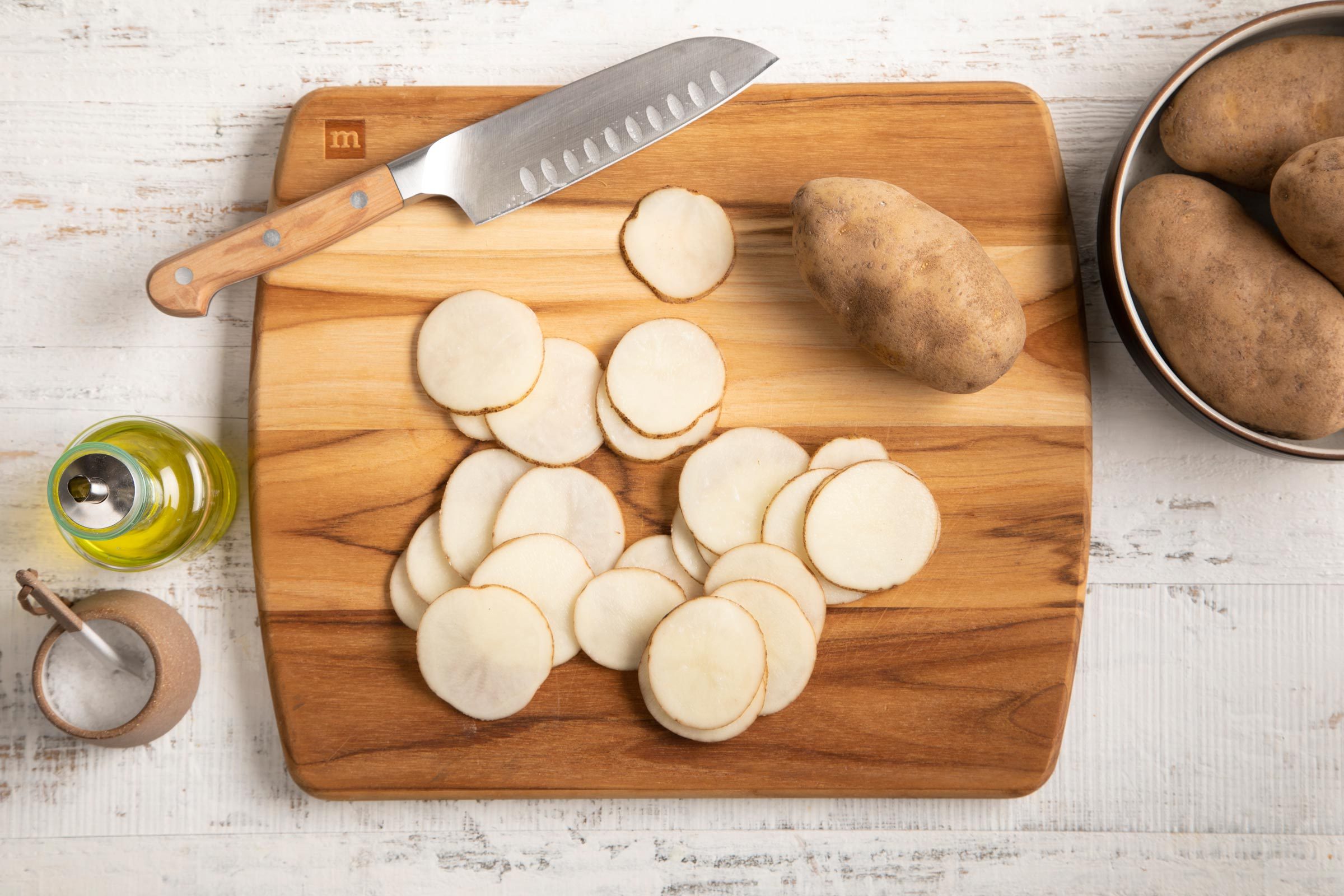 raw potatoes cut into chip slices