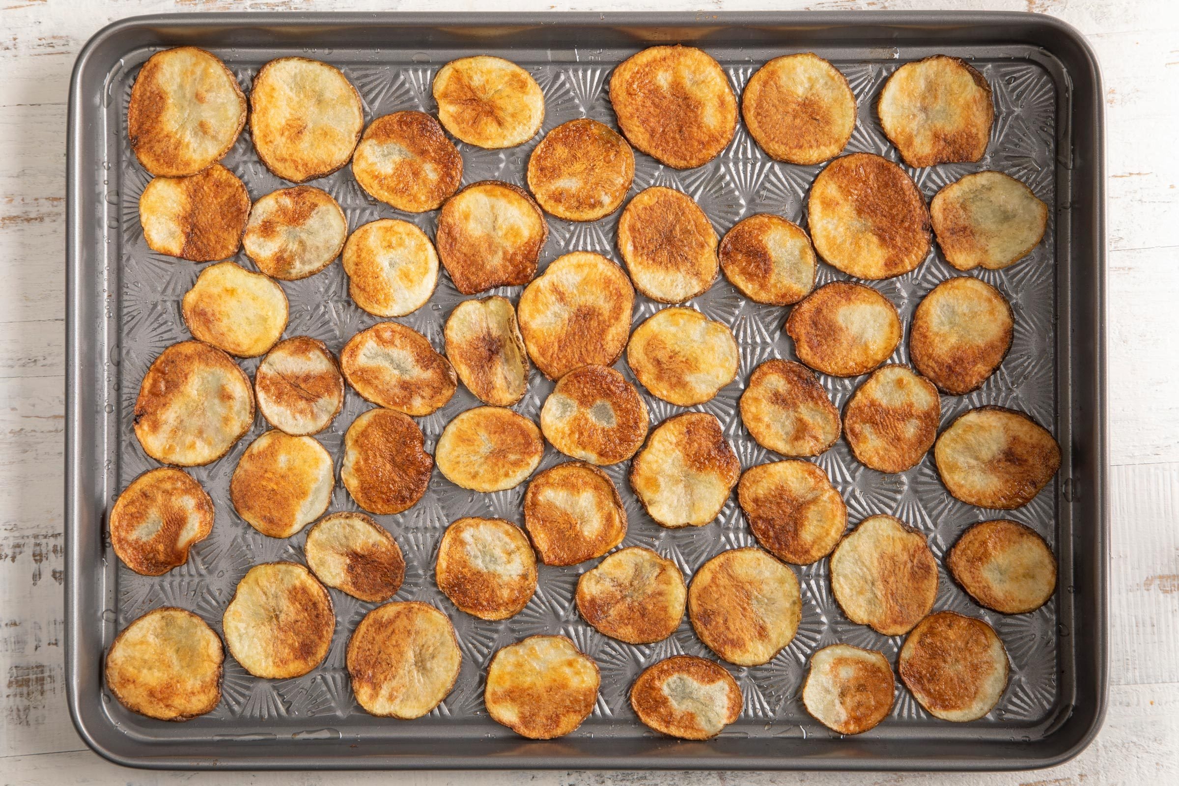 baked chips on a baking sheet