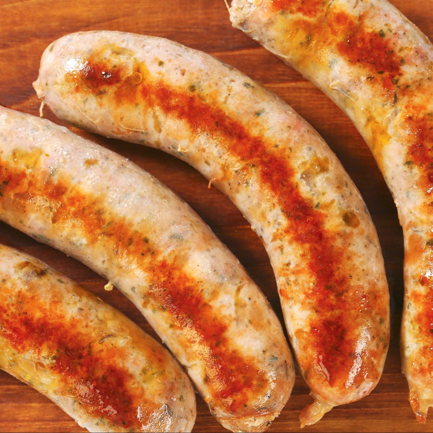 Grilled sausages on a cutting board