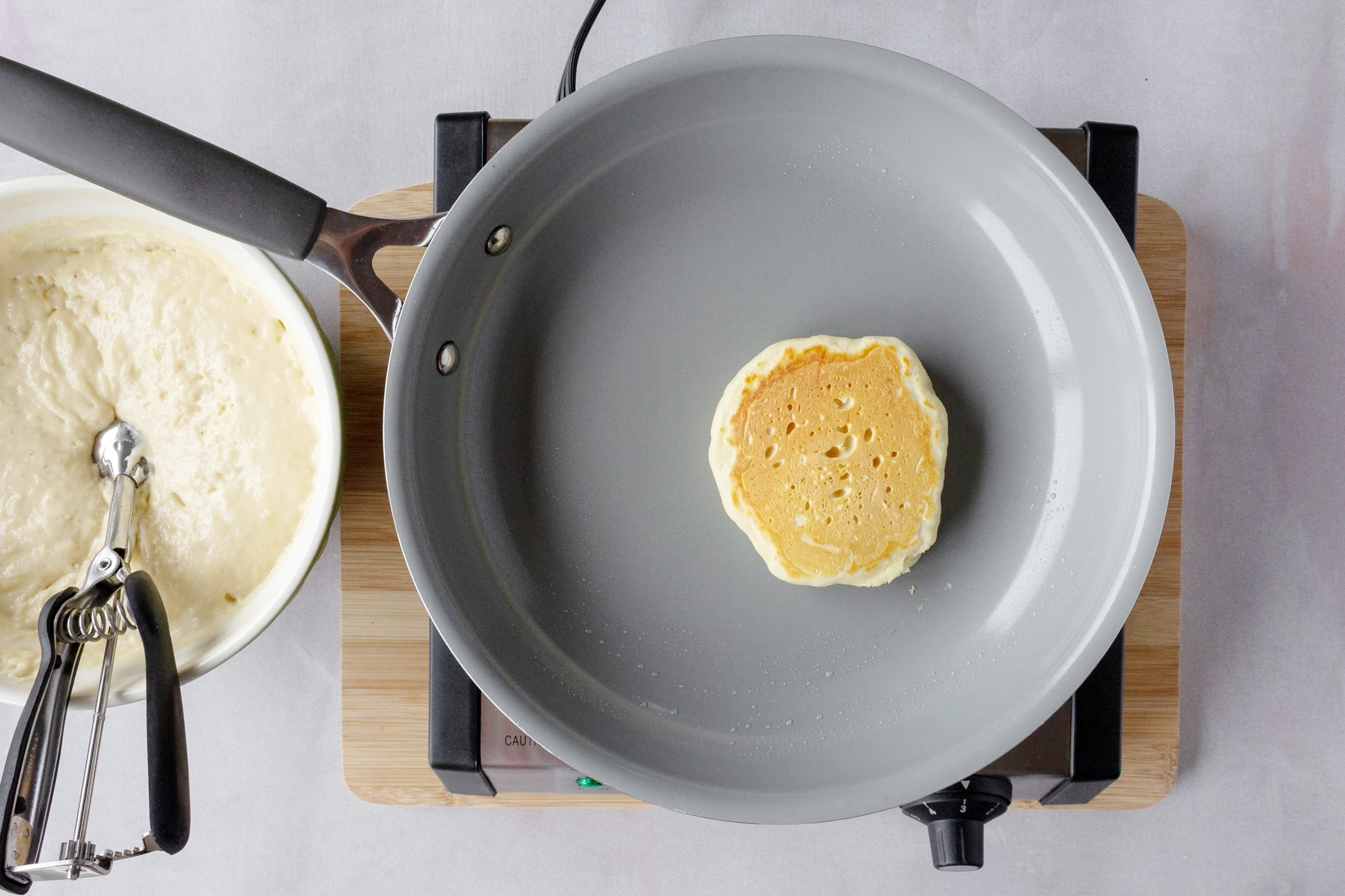 the golden brown side on a pan while cooking a pancake