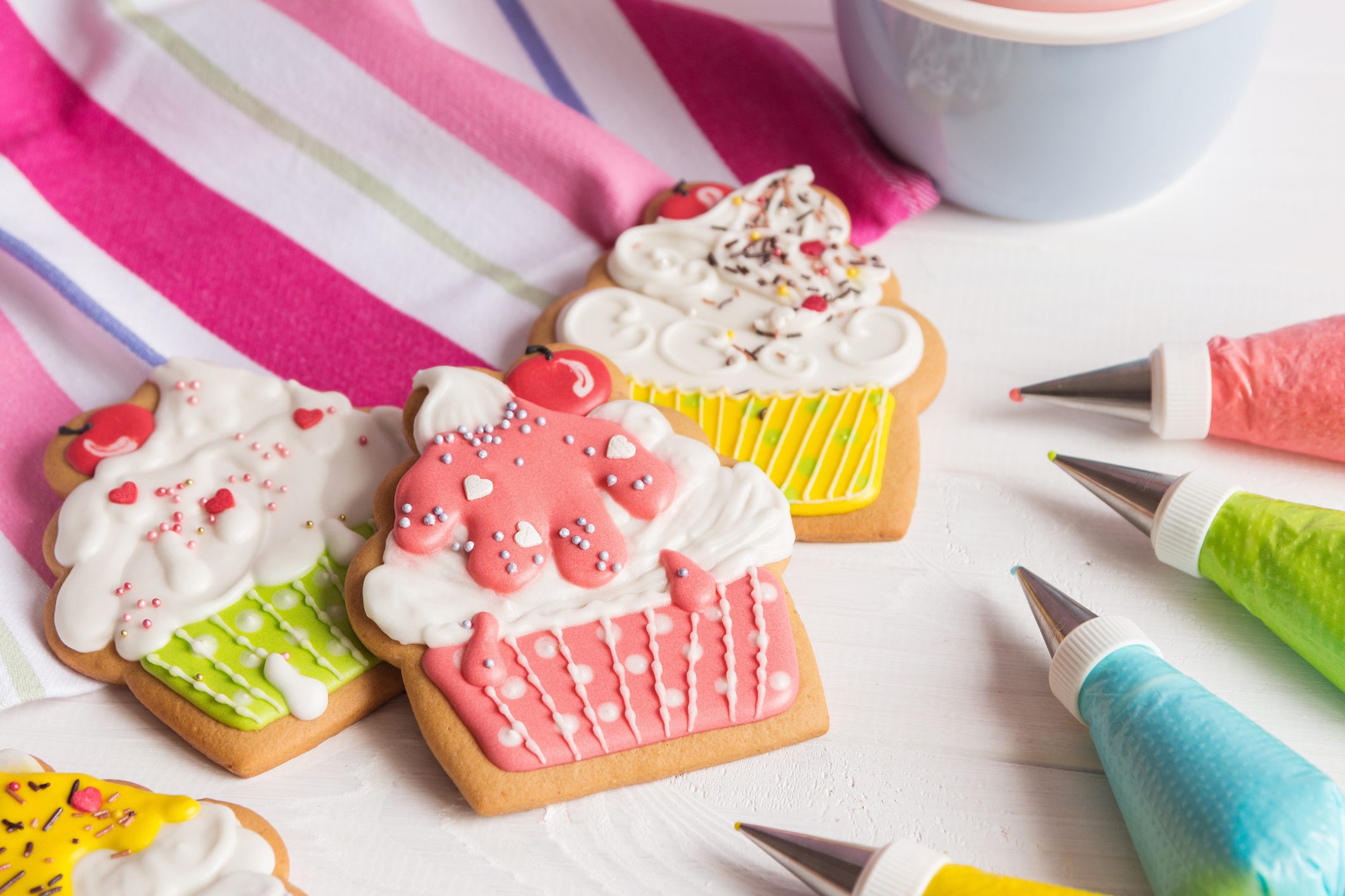 Colorful icing cookies in cupcake shape