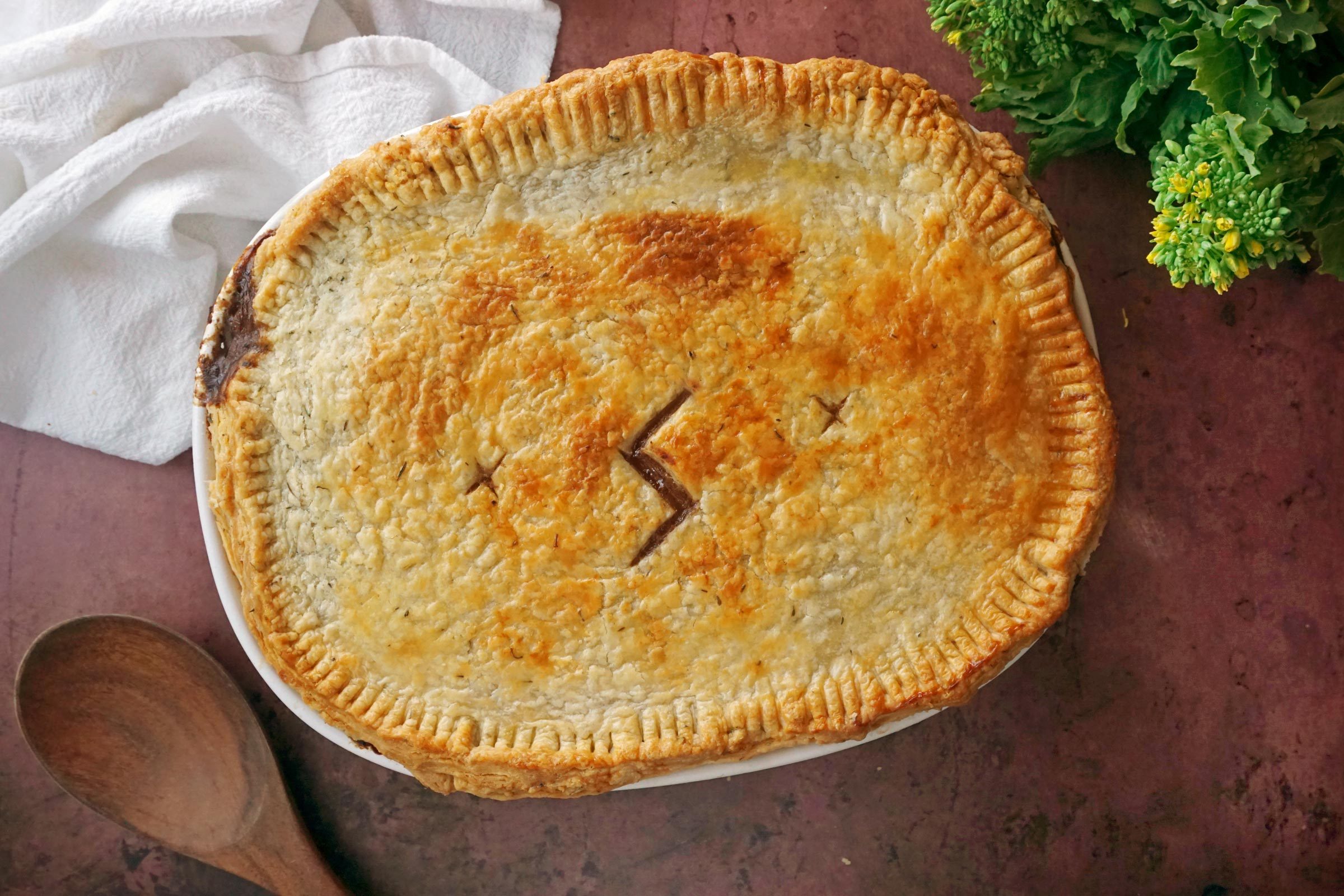 baked steak and kidney pie with a lightening bolt shape in the middle