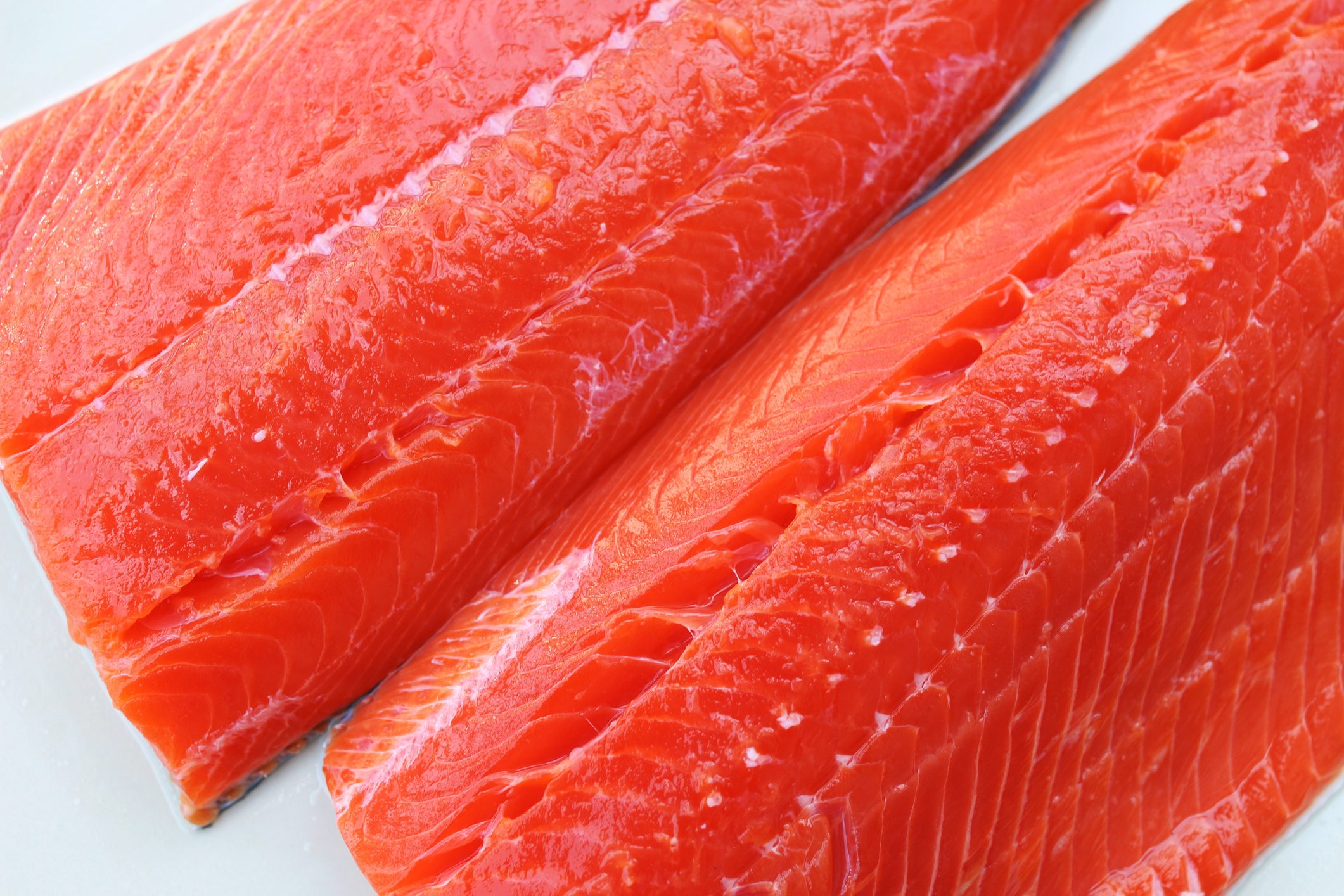 Sockeye salmon fillets on a white background