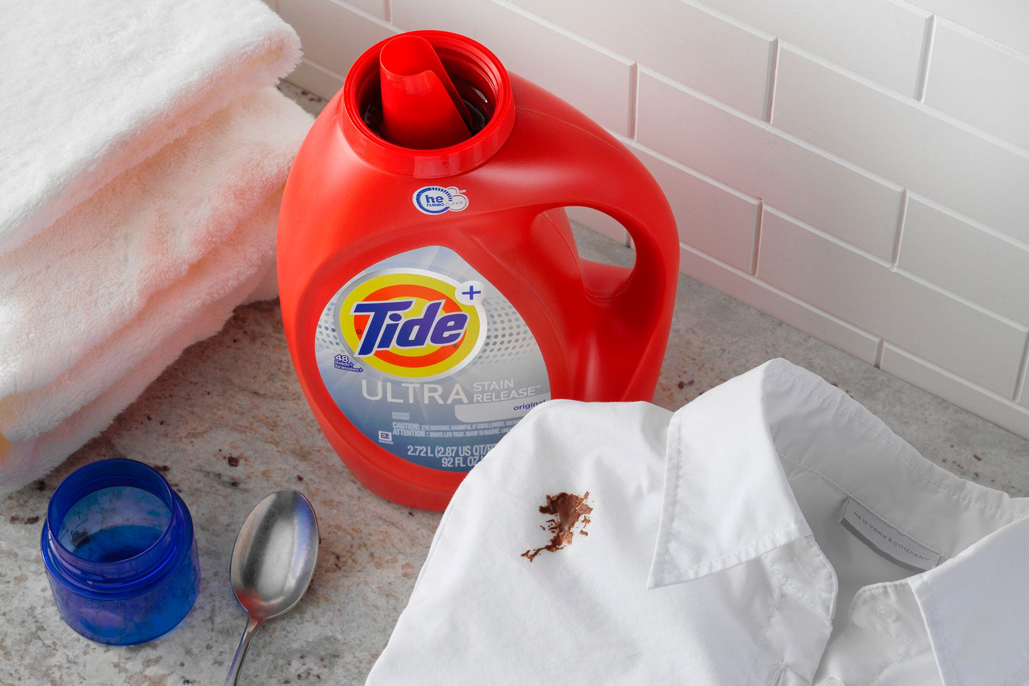 chocolate stained shirt With Tide And Towels And A Spoon