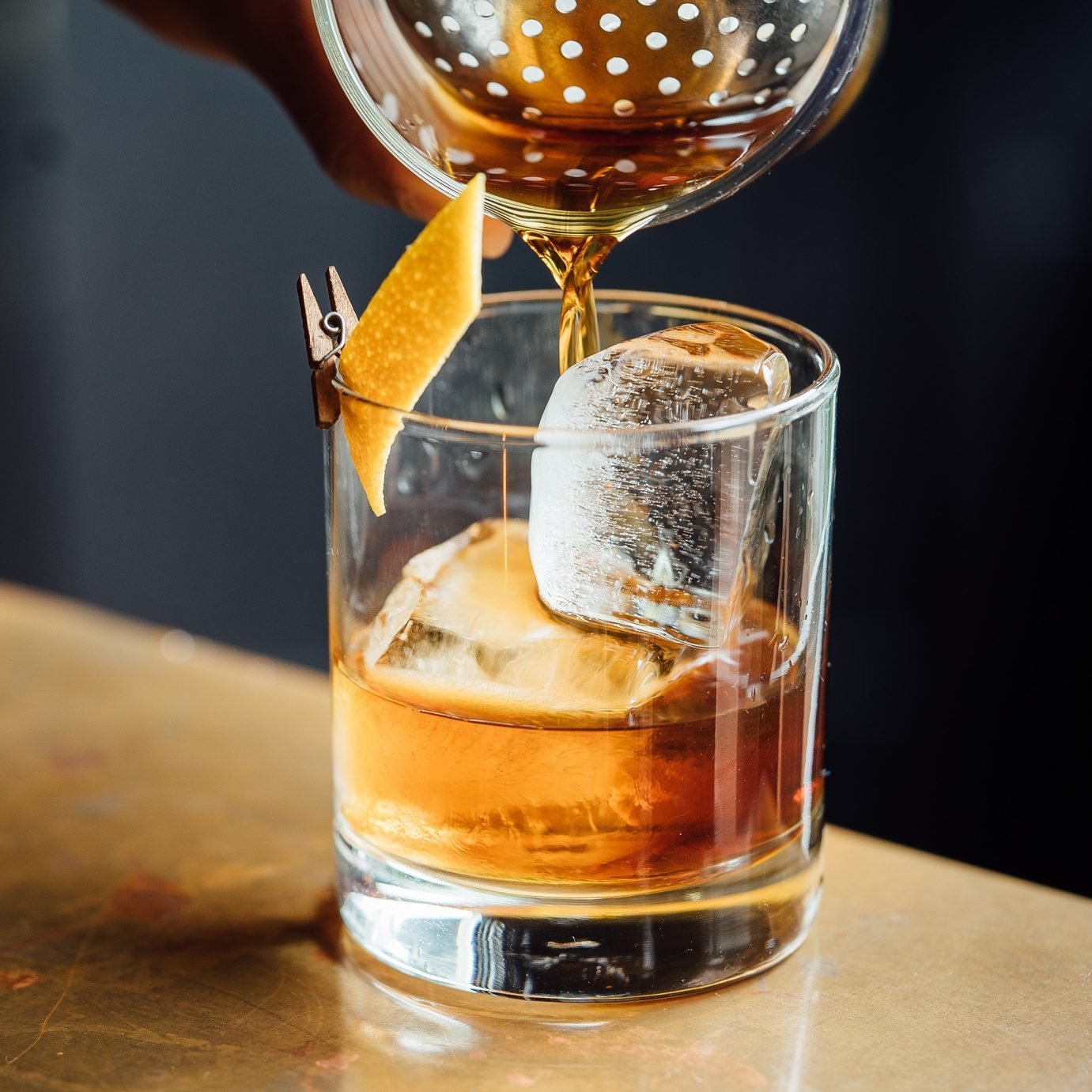 Closeup Glass with Alcohol in Cocktail Bar