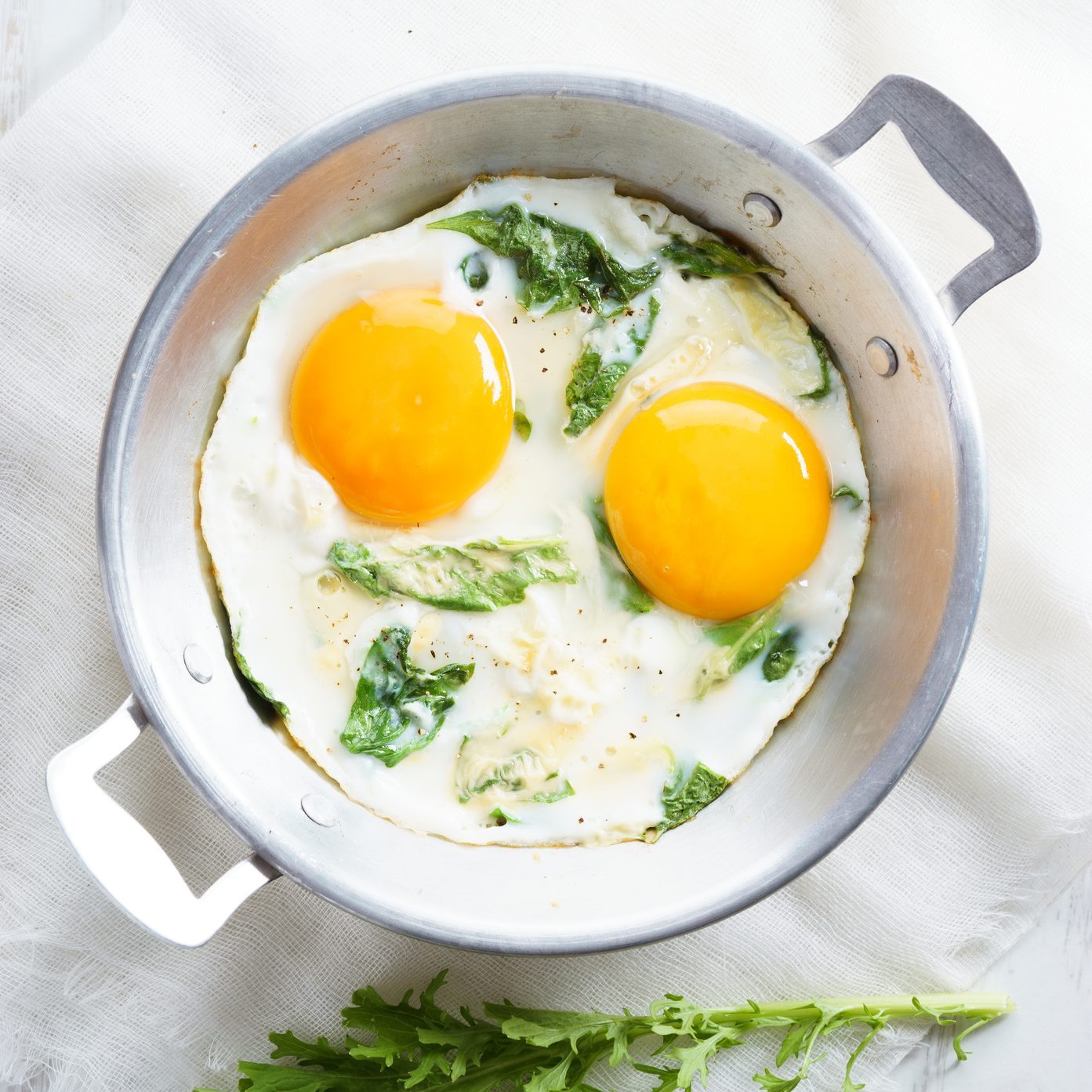 fried egg with green spinach