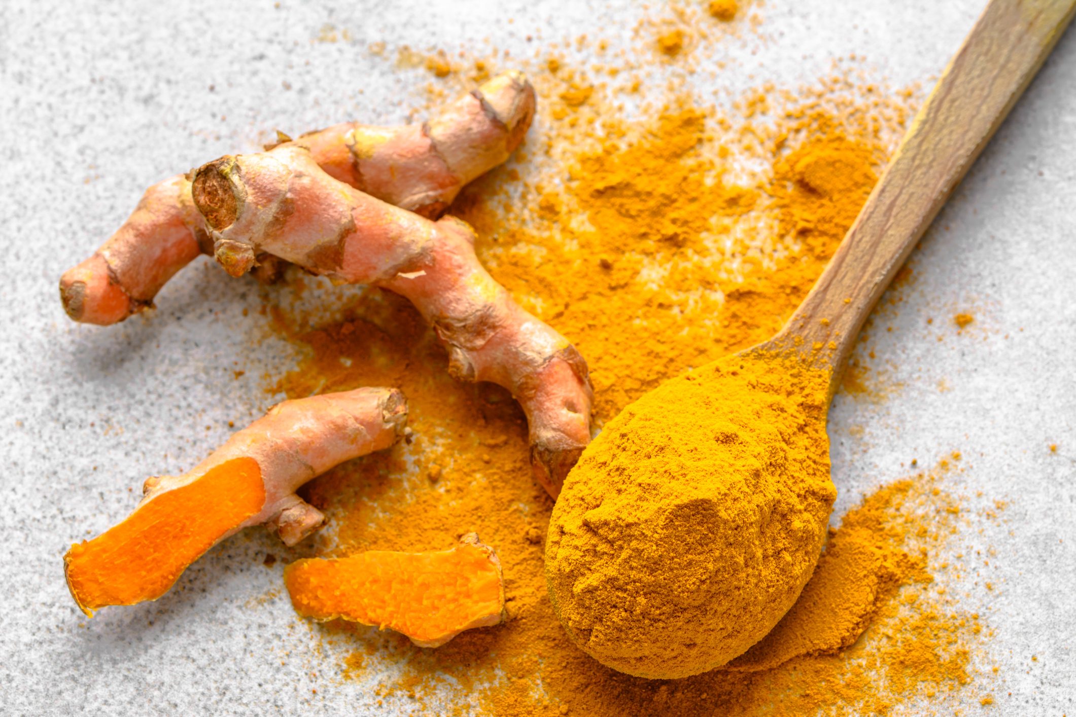 Fresh root and turmeric powder, indian spice, healthy seasoning ingredient for vegan cuisine