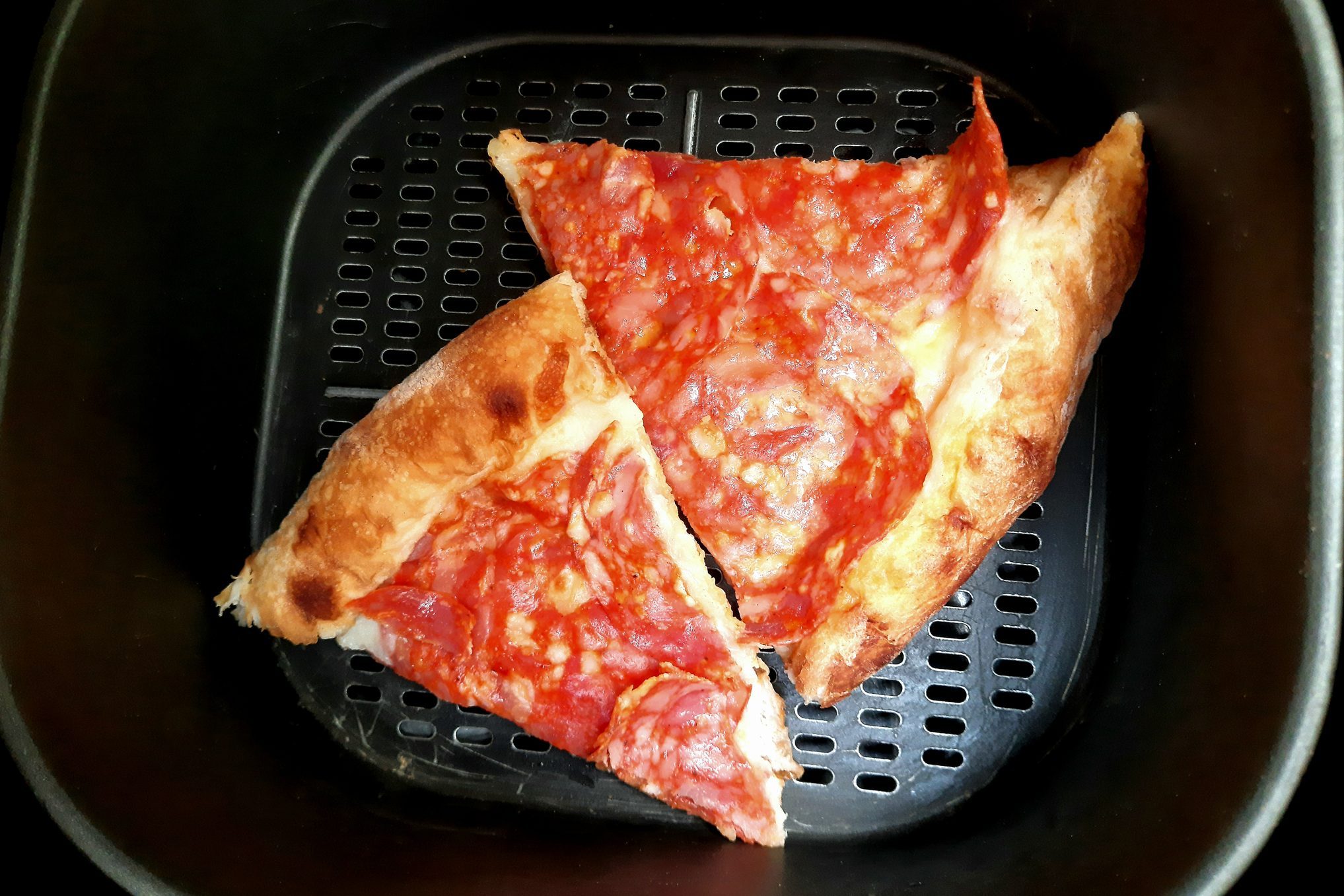 Heating Leftover Pizza in air fryer.
