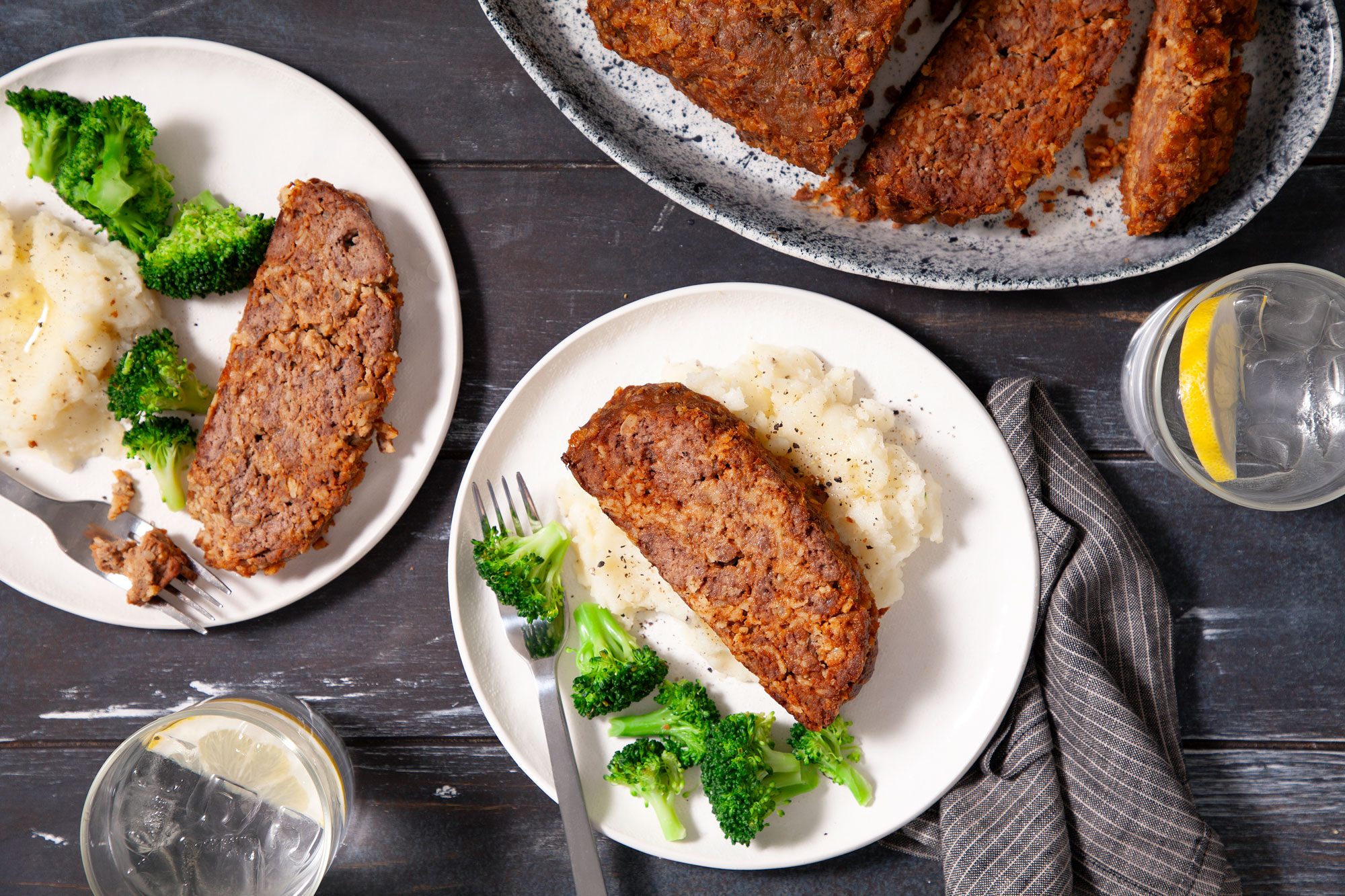 Onion Meat Loaf sliced and served with broccoli on side