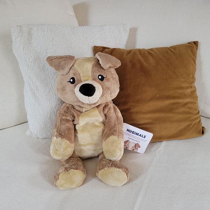 Hugimals on bed with cushions