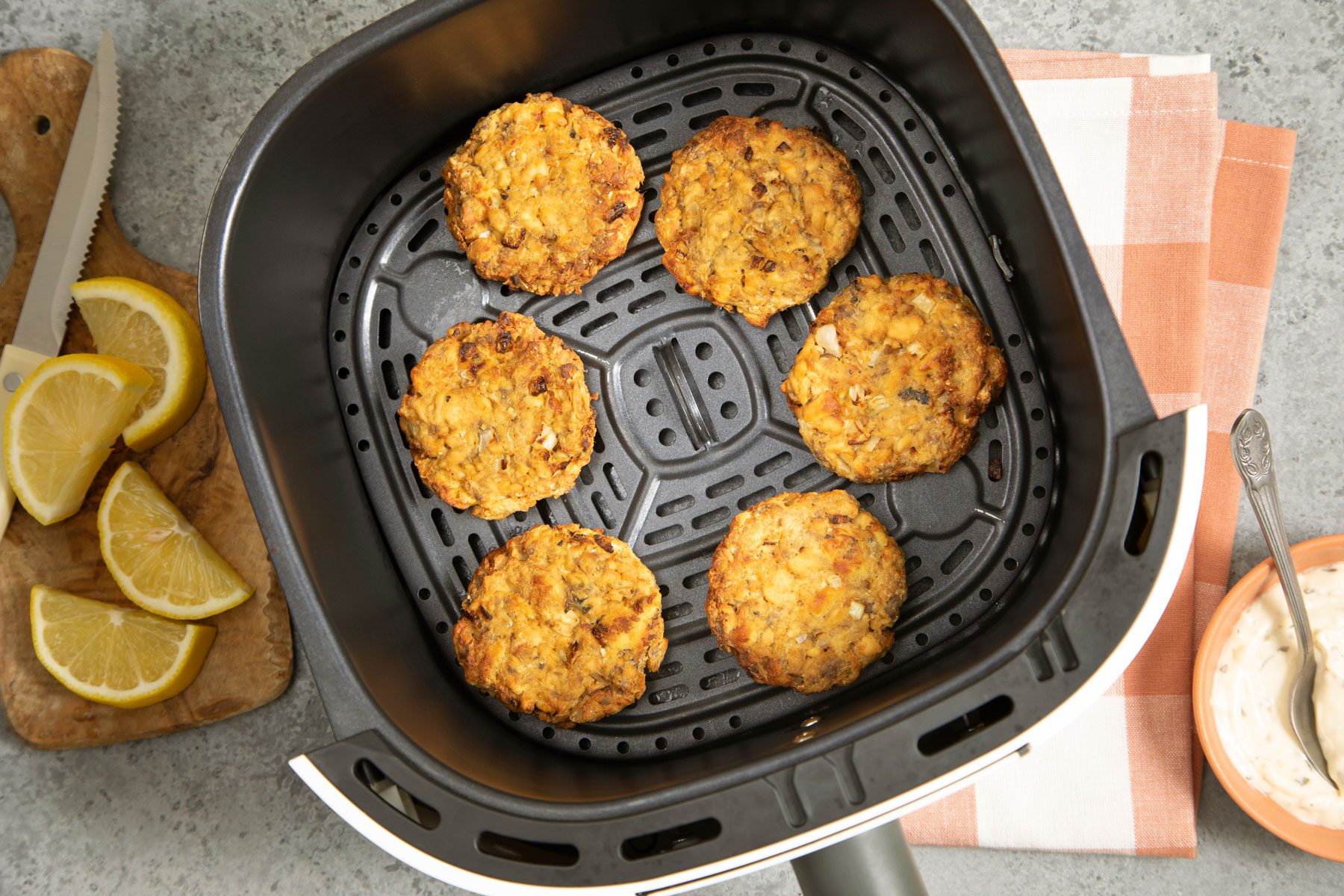 Golden brown Salmon Patties in an air fryer