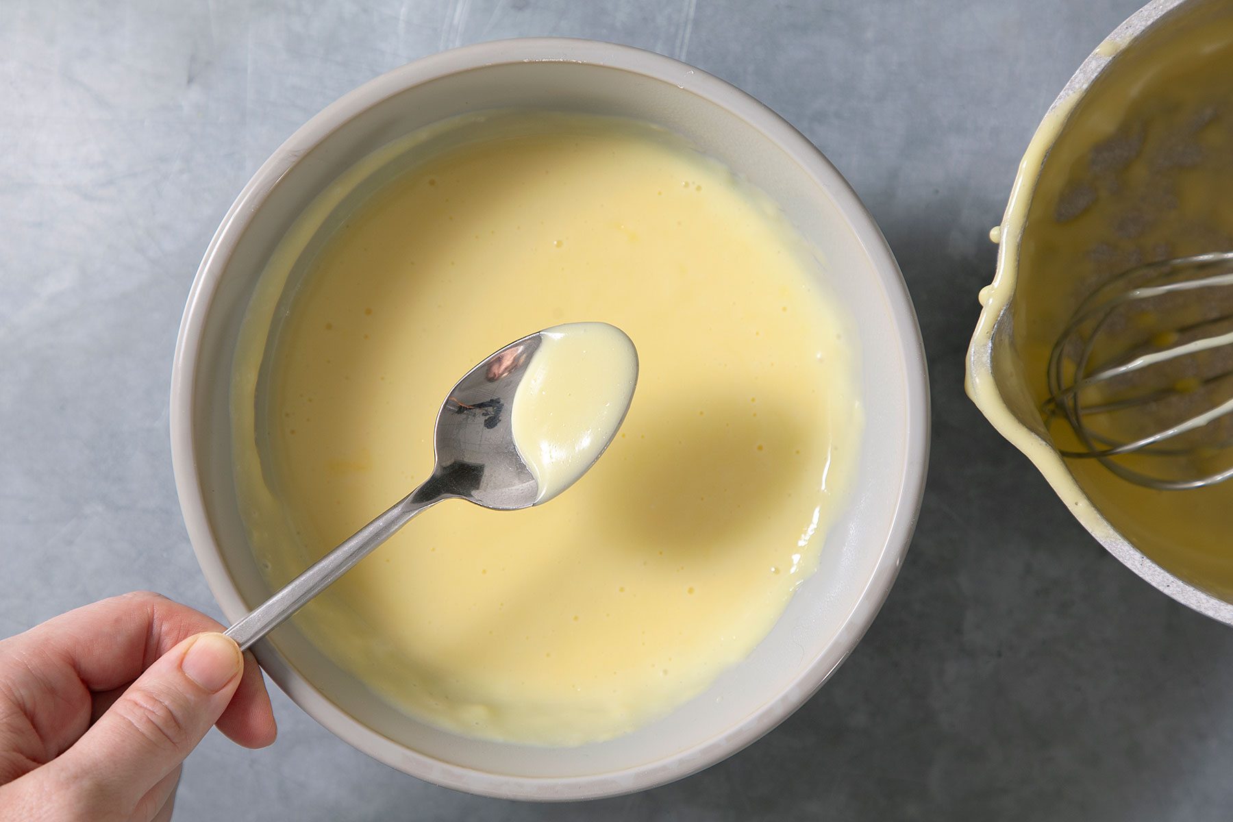 Checking the cream with sppon