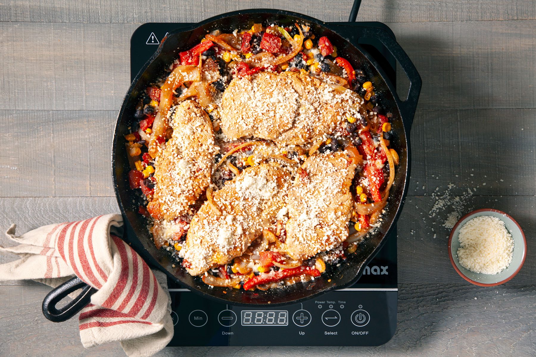 Vegetables and Chicken mixed together with cheese on top