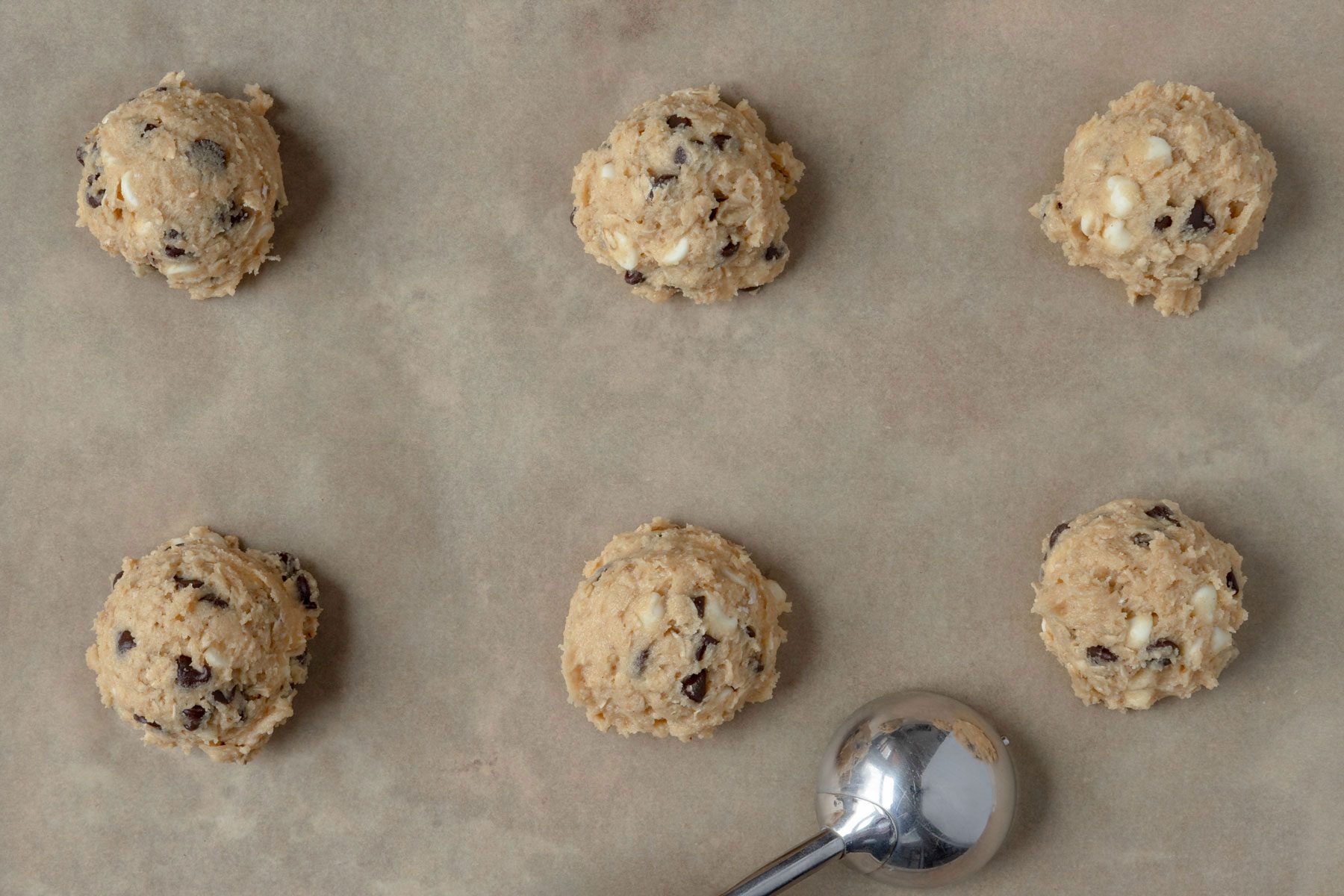 Scoops of dough on baking sheet