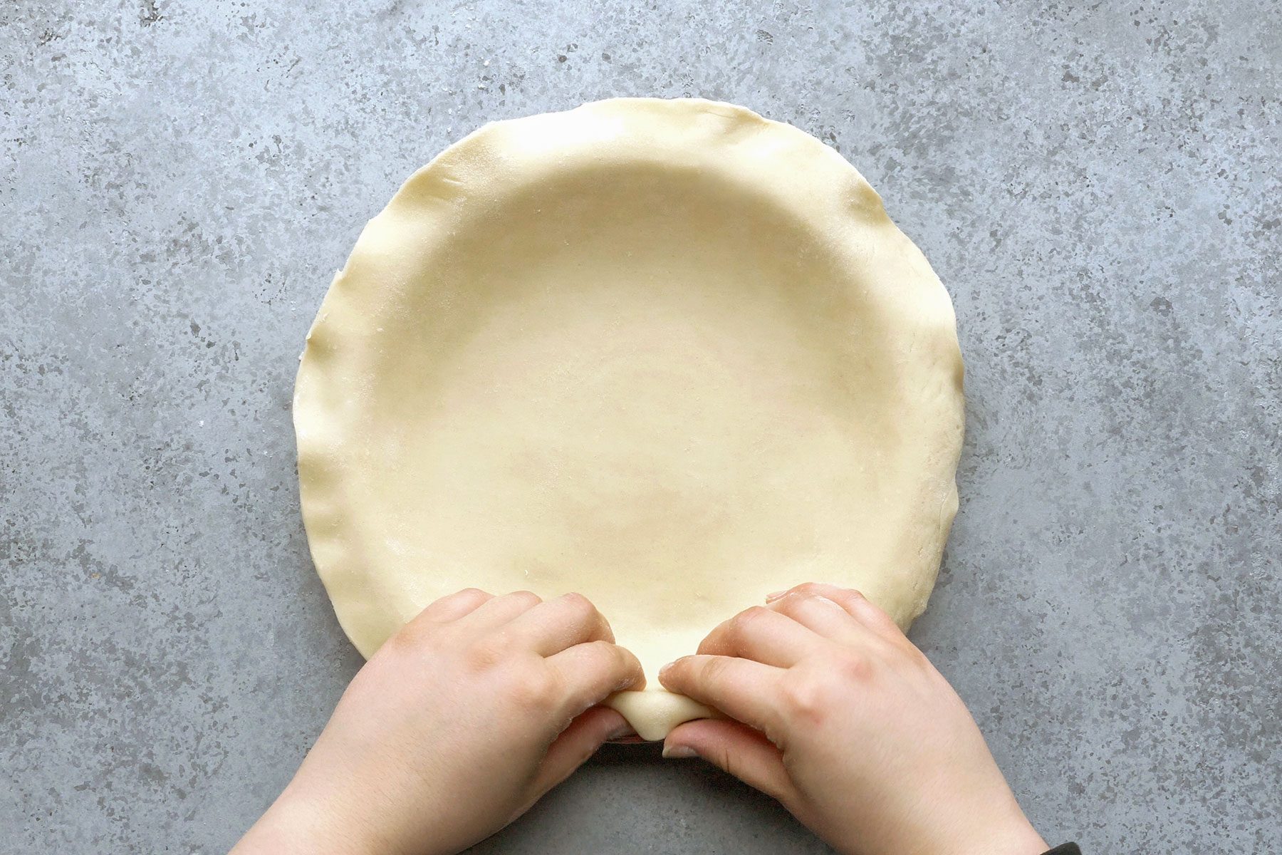 Trimming the edges of dough