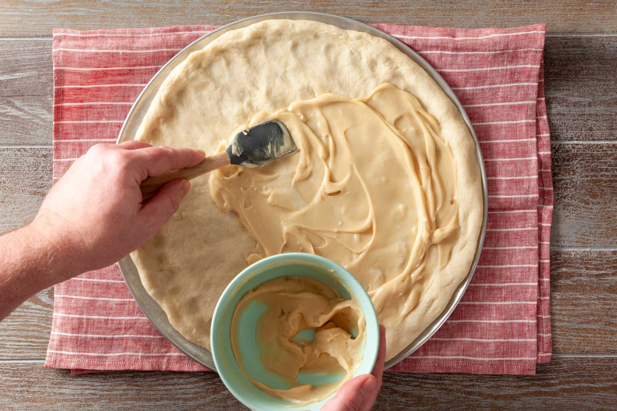 Spread the cheese and apple topping on top of the dough