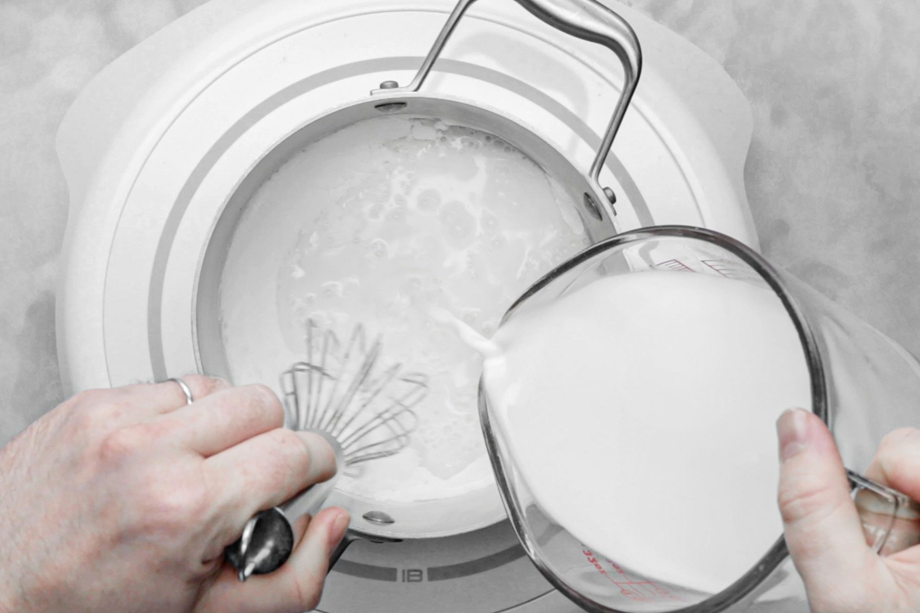 Whisking sugar, cornstarch, salt and milk in large saucepan