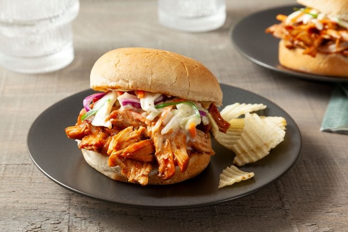 Barbecue Chicken Sliders Served on a Plate on wooden surface