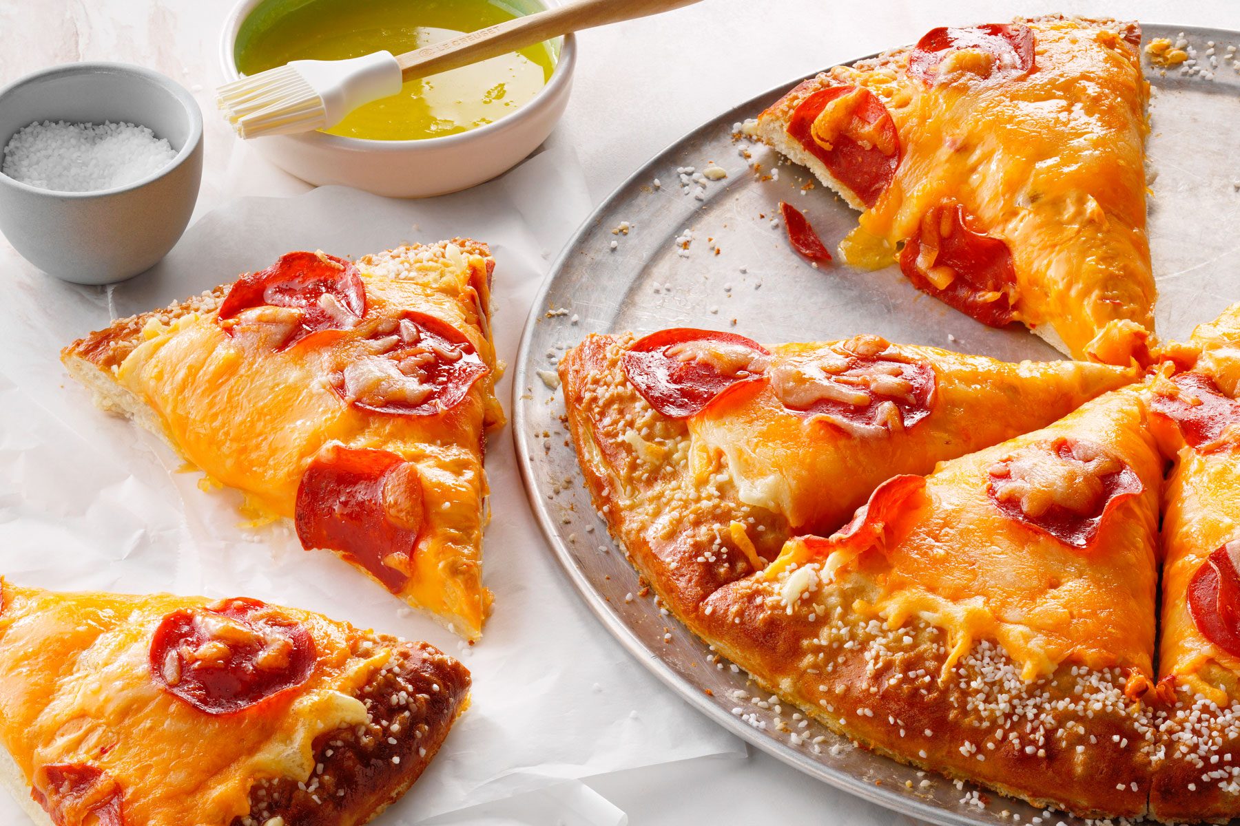 Slices of Copycat Little Caesar's Pretzel Crust Pizza in a large plate