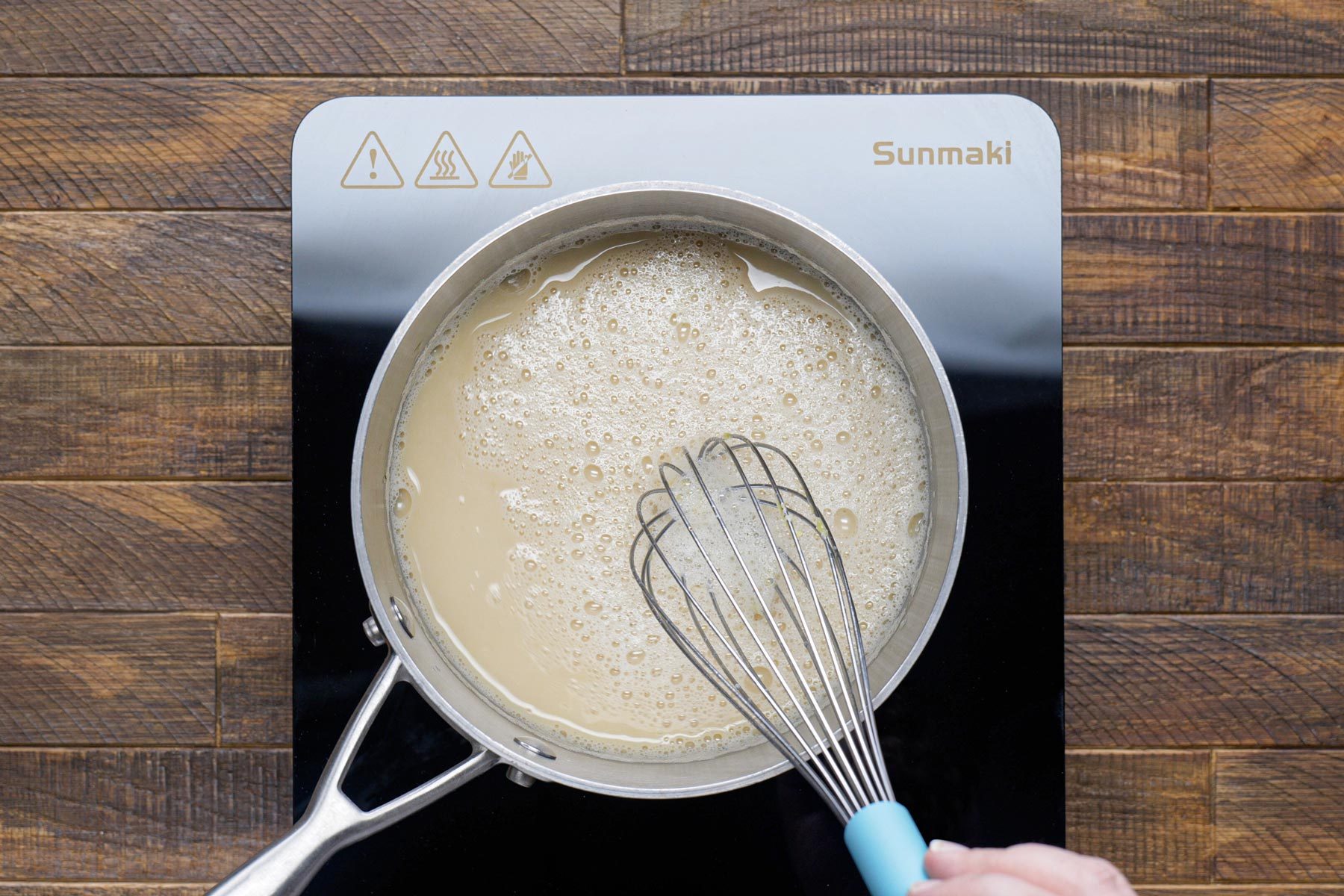 Cooking avgolemono sauce in a sauce pan 