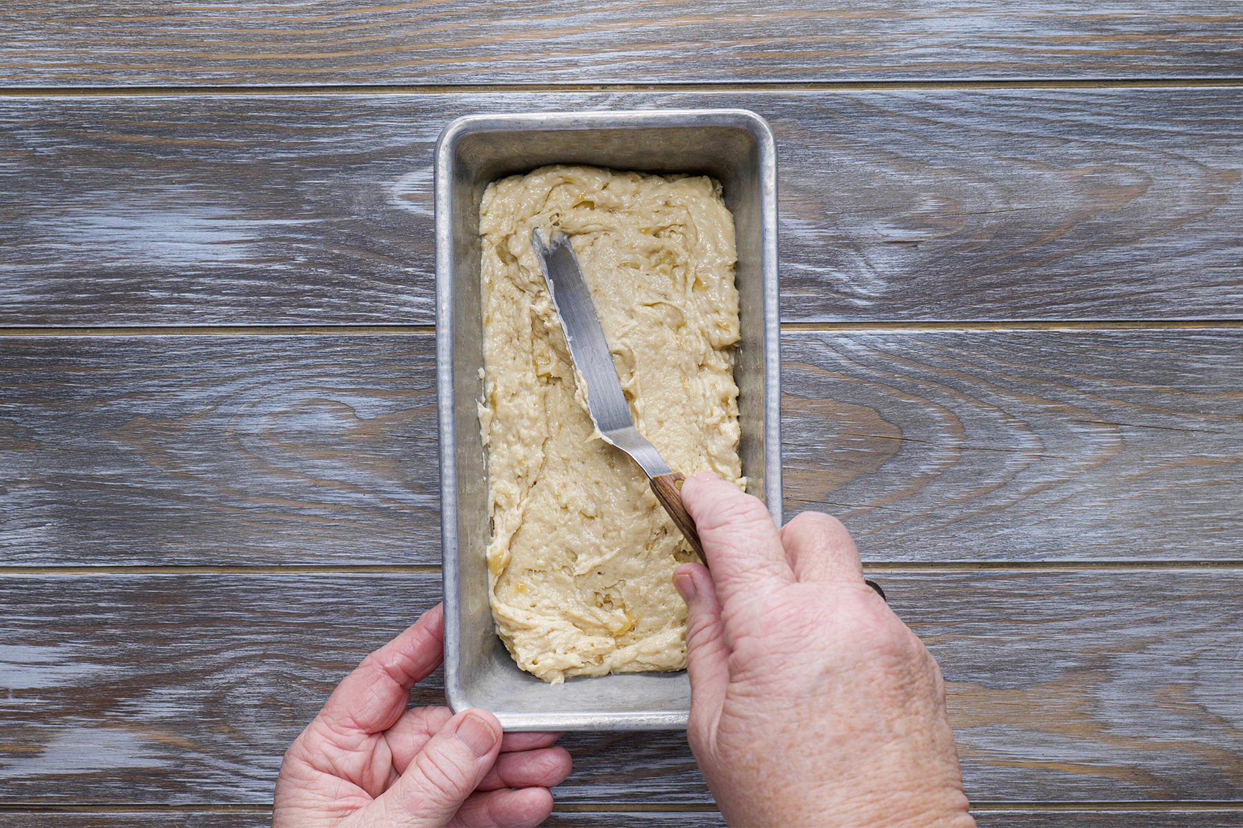 Spreading batter of Easy Banana Bread in pan